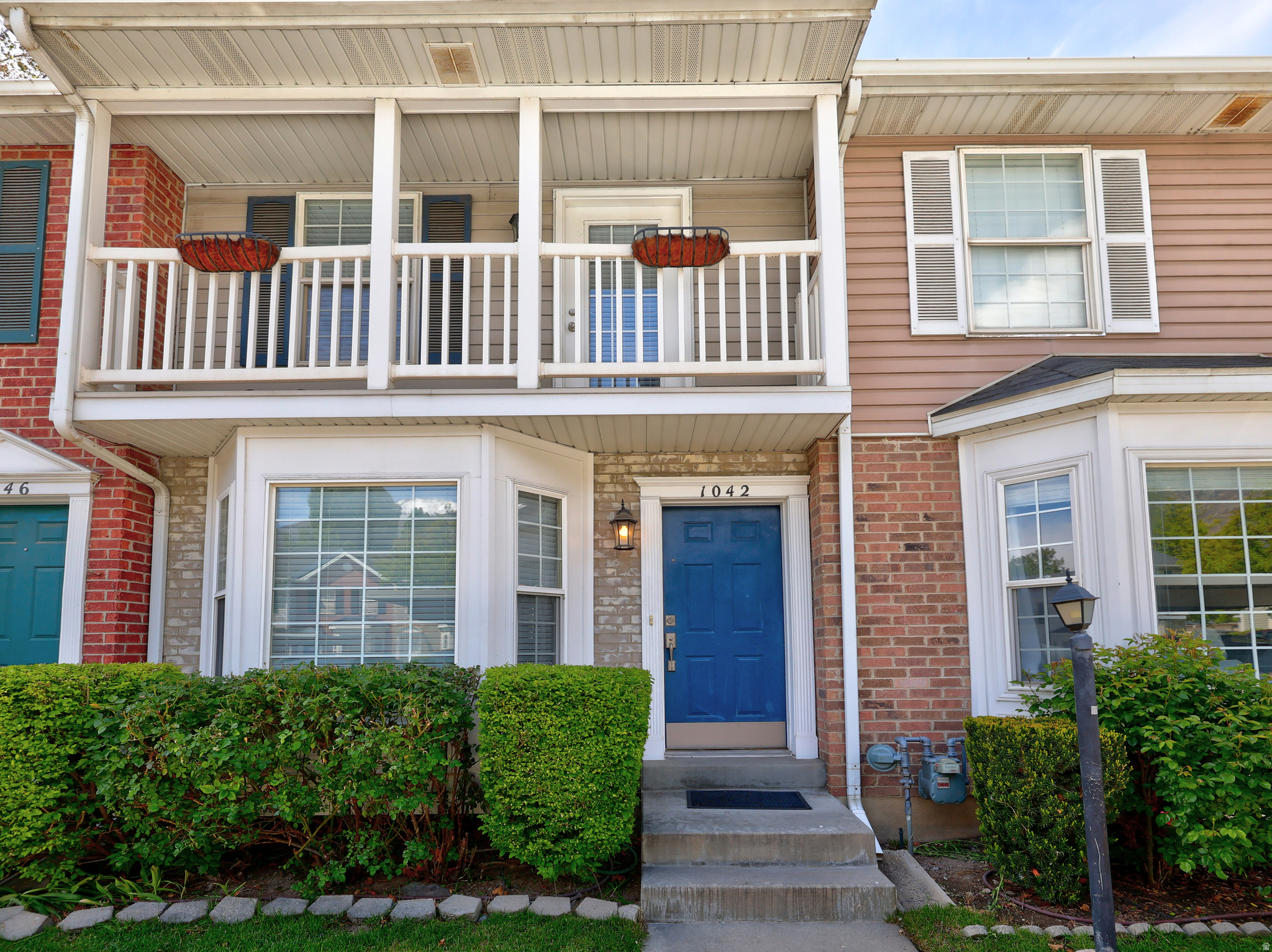 $5,000 credit towards closing costs available. Also 100% financing available for 1st time homebuyers. Move-in Ready Townhome in Prime Provo Location with beautiful mountain views!  This charming 2-bedroom, 1.5-bath townhome recently updated. Newly added in 2024: Shower, Tub, Toilets, dishwasher, and Glass-top Range. All stainless steel appliances are included. The main floor offers a spacious family room, half bath, laundry, and kitchen. Upstairs you'll find two large bedrooms, a full bathroom with linen closet, and attic storage. The master bedroom features a private balcony. Enjoy your enclosed patio and outdoor shed in the private, fully fenced backyard, which backs up to a common grass area with a playground, picnic tables, and grills - perfect for pets or relaxing. Located minutes from BYU, UVU, Provo City Center, and freeway access. The HOA handles snow removal and front yard landscaping for true maintenance-free living. Rentals are approved. Additional highlights include 2" wood blinds throughout and two parking spaces (one covered, one uncovered).