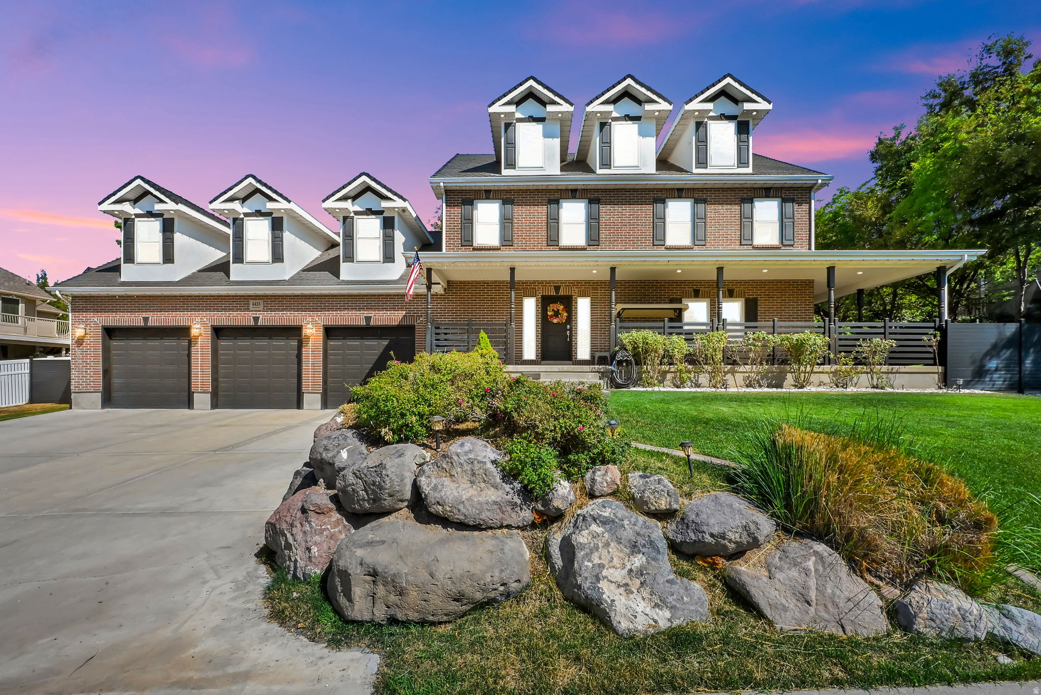 Perched high on Bountiful's coveted east bench in prestigious Bridlewood Estates, this exceptional estate offers luxury living with breathtaking Great Salt Lake sunsets, just minutes from downtown Salt Lake City, the airport, Eaglewood Golf Course, and endless Wasatch Mountain recreation. Completely renovated throughout, the home showcases premium Dacor appliances, waterfall granite countertops, a pot filler, hidden walk-in pantry, custom cabinetry, new flooring, paint, carpet, energy-efficient windows, new AC units, and new water heaters. The luxurious primary suite features dual "His/Hers" walk-in closets, a spa-inspired bath with a soaking tub, 12-jet shower, and fireplace. Designed for both entertaining and everyday living, the fully finished basement includes a private theater, fitness room, and oversized cold storage. Step outside to your own backyard retreat featuring a tranquil rock waterfall, brand-new pickleball court, and spacious gathering areas. Smart home technology allows you to control the waterfall, climate, front door, and safety systems from your phone. The oversized three-car garage comfortably accommodates up to five vehicles and includes an EV charging station. Combining luxury, recreation, and an unbeatable location, this one-of-a-kind property offers an incredible opportunity to experience the very best of Bountiful living.