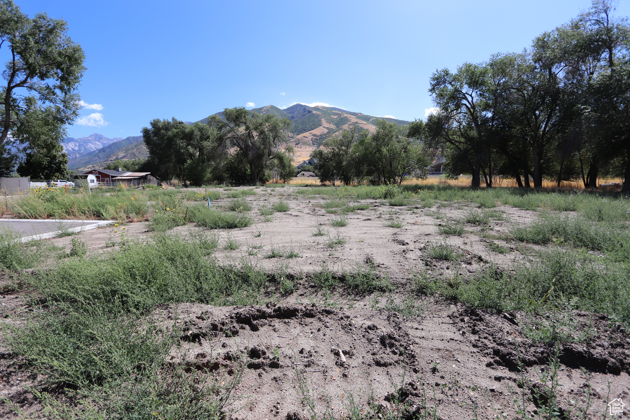 Build your dream home on this flat 0.462 acre lot in Draper! Breathtaking Wasatch Mountain views and direct trail access for outdoor enthusiasts. All utilities (water, power, gas) are stubbed in, making development a breeze. Close to shopping, golf, and parks.