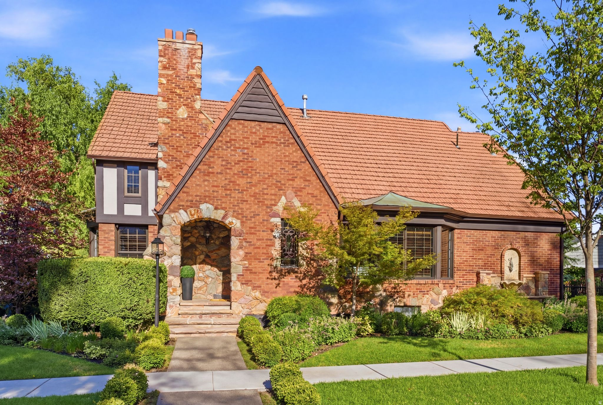 Historic Federal Heights Tudor with flexible living near the University of Utah, hospitals, downtown Salt Lake City, and the Avenues. This 5-bed, 5-bath, 4,072 sq ft residence blends 1937 character with fresh carpet, fresh paint, and an adaptable layout. The main home offers 4 bedrooms and 4 baths, plus an optional independent 1-bed/1-bath apartment with separate entrance that can remain separate or reconnect to the home. Classic charm, refreshed finishes, and a rare location-flexibility combination under $1.7M.