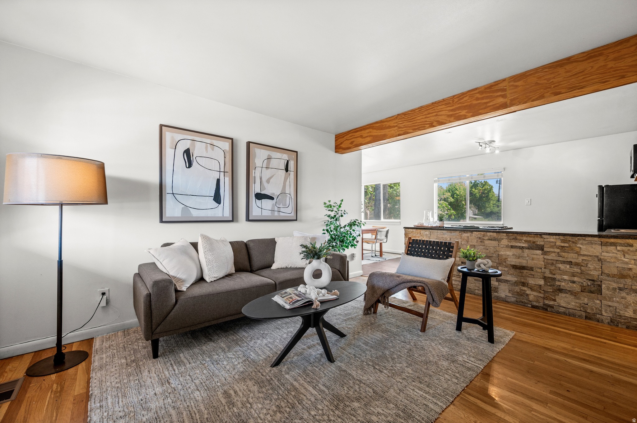 Sunny top-floor condo with beautiful southern views! This well-designed unit features a spacious dining area rarely found in similar condos, hardwood floors, in-unit laundry, and an abundance of natural light. Enjoy a vibrant community with a pool, fitness center, dog park, secure access, and designated parking. Pets are welcome! Ideally located for downtown living with easy access to restaurants, shopping, nightlife, and the University of Utah. Low HOA dues and competitively priced-this is an exceptional opportunity for homeowners, students, or investors alike.