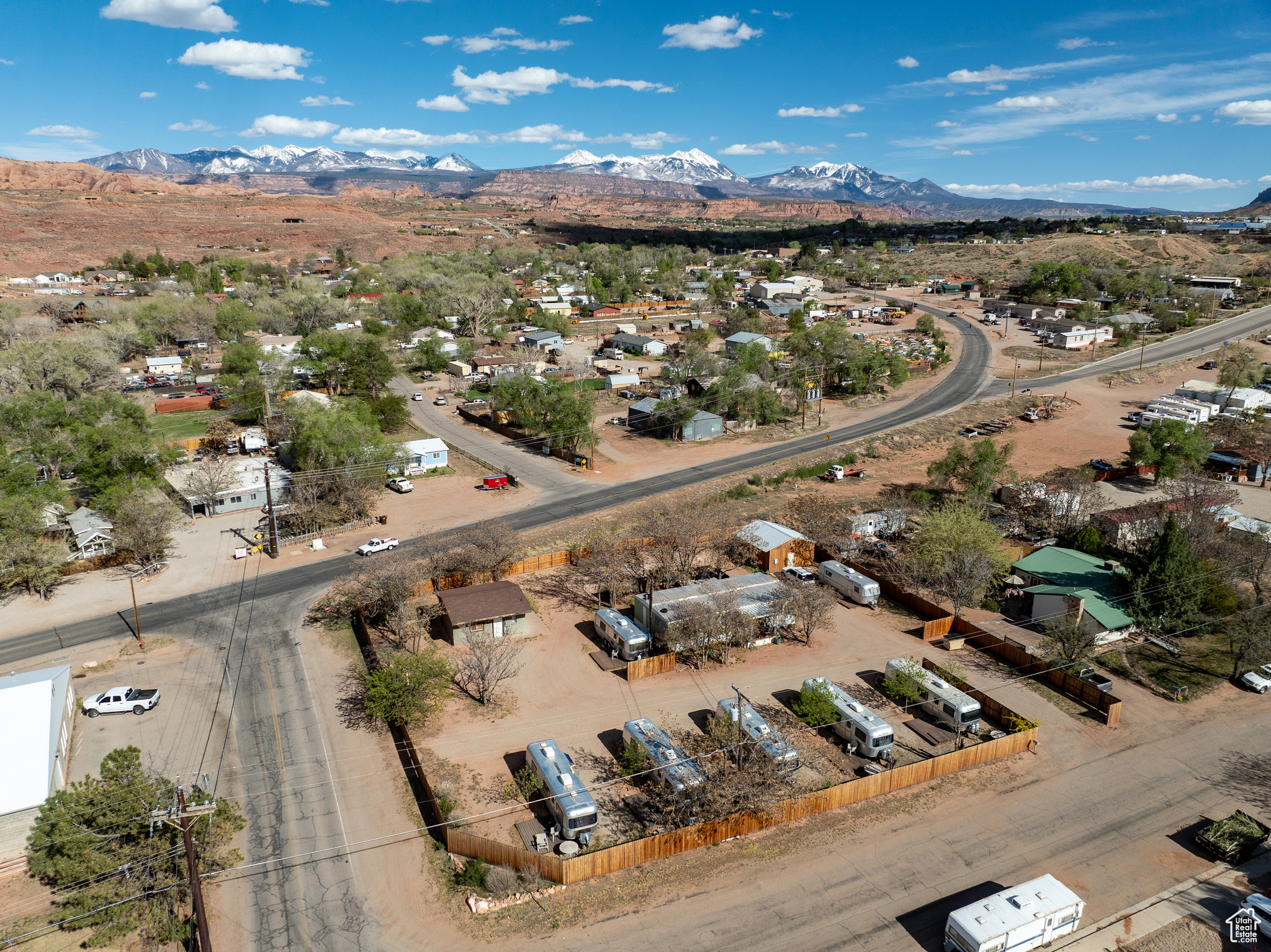 Located in the heart of Moab, adjacent to Mill Creek Drive and in the center of one of Moab's major redevelopment districts, this distinctive short-term rental property offers a prime investment or boutique lodging opportunity. Just moments away from the lively downtown area, this property includes a charming collection of vintage trailers, a classic residence, a communal laundry/washroom, and an authorized lodging permit, presenting an eclectic and rare asset in Moab's restrictive short-term rental market. Nestled within a bustling short-term rental area along Mill Creek Drive, this property benefits from high visibility and access, making it ideal for short-term rentals. This property is minutes from numerous popular intersections including Spanish Valley Drive - Mill Creek Drive, and Mill Creek Drive - Highway 191/Aggie BLVD, home to Moab's new state-of-the-art USU campus. Zoned Highway Commercial use and including an approved Permit for Short-Term Rentals (ATTACHED), it allows for a variety of business activities including the coveted option for short-term rentals-a scarce and valuable feature in Moab. This property stands out as a unique opportunity in a key redevelopment area, perfect for an investor looking to capitalize on a mix of commercial flexibility.