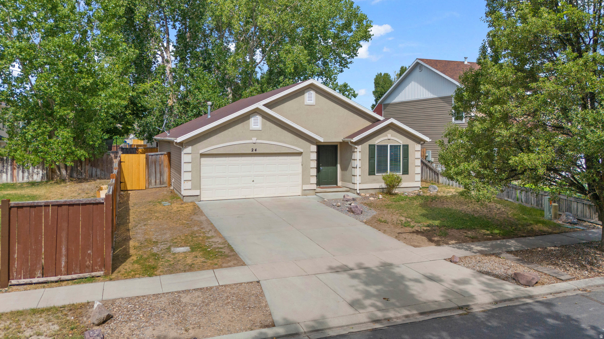 Nestled in the Loch Lomond neighborhood of Saratoga Springs, this well-loved rambler offers easy single-level living with a warm, comfortable feel. The open living area features vaulted ceilings, great natural light, and a functional layout that keeps things simple but cozy. The kitchen opens nicely to the main living space and features brand new flooring. The sliding glass walkout door leads to a peaceful, fully fenced backyard with mature trees. With 3 bedrooms, 2 full baths, a 2-car garage, no HOA, and a beautiful park directly across the street, this one-owner home is the kind of place that feels easy to settle into. Close by is access to the Utah Lake Parkway Trail that connects to the Jordan River Trail with 50+ miles of walking and biking trails, and on foot access to 3 ponds and the lake shore. Clean, well cared for and loved, this home is ready for its next chapter! *A recent appraisal has been done*