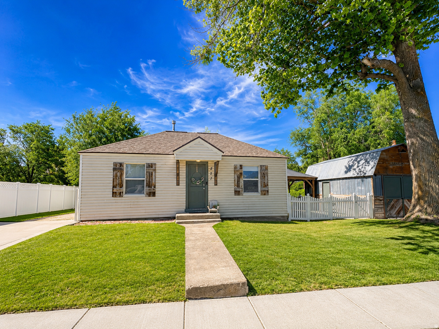 Charming 3 bedroom, 2 bath home in a great Payson location, tucked into a mature and established neighborhood. This home has an adorable interior, a new roof, and updates throughout. The spacious yard is inviting and easy to enjoy, with a cozy outdoor pergola, chicken coop, irrigated grow boxes, and plenty of room to relax, garden, or entertain. Need a little extra space? The detached barn has been fully finished into a seriously cool hangout spot, complete with power, couches, and A/C. It is perfect for movie nights, hobbies, a game room, office space, or just a fun place to unwind. There is also extra storage above the barn. Inside the home, you'll find thoughtful extras, including root cellar access and a top-of-the-line water softener with a reverse osmosis system servicing the kitchen. Cute, updated, and full of character.