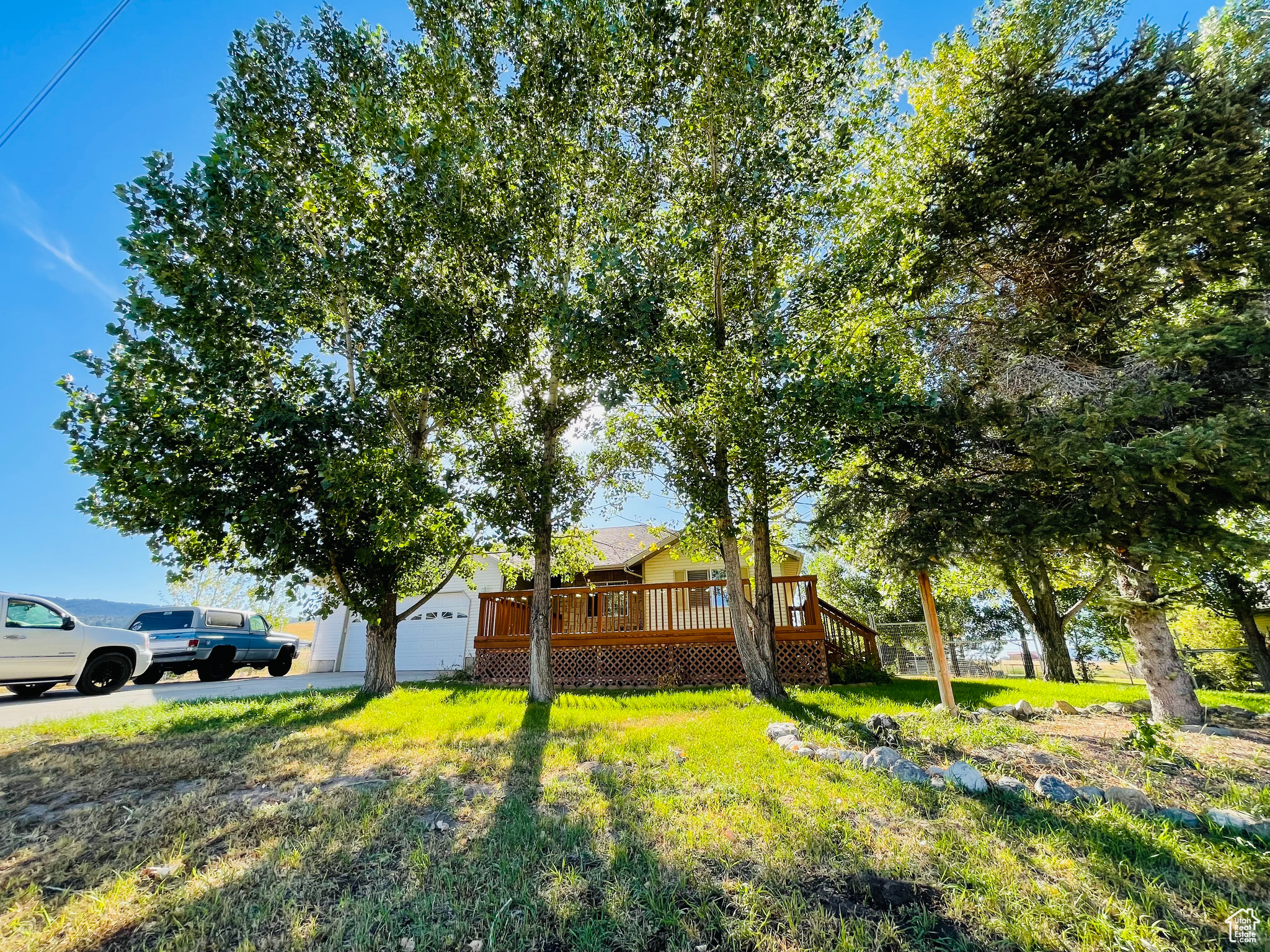 Beautiful Move-In Ready Home in Lava Hot Springs! Discover this stunning, completely updated home nestled in the natural beauty of Idaho's premier destination community. Surrounded by open space and mature landscaping, this property offers the perfect blend of comfort and recreation. Recent Updates & Features:  New roof for peace of mind- New carpet throughout- Fresh paint creating a bright, welcoming atmosphere- Large, beautiful deck perfect for entertaining and relaxation- Mature trees providing natural shade and privacy- Fenced backyard ideal for pets and children- Light and bright basement with large family room for additional living space- Two-car garage for convenient parking and storage.  Prime Location Benefits: Located in the heart of Lava Hot Springs, you'll enjoy easy access to: Fine dining establishments- World-famous thermal pools for year-round soaking- Recreational opportunities including hiking, fishing, and river activities- Destination community atmosphere with tourism amenities- Golf course privilages available and within walking distance.   Lifestyle Appeal: This home is perfect for those seeking a vacation retreat, investment property, or year-round residence in one of Idaho's most charming communities. The combination of recent updates, natural setting, and proximity to Lava Hot Springs' attractions makes this an exceptional opportunity. Move in and start enjoying the hot springs lifestyle immediately!