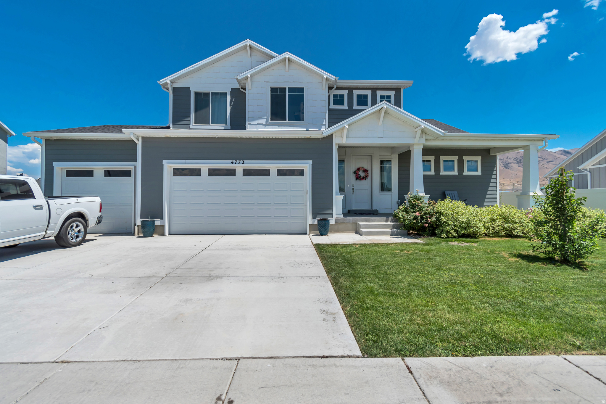 Beautifully maintained 4-bedroom, 2.5-bathroom home in Eagle Mountain.  This thoughtfully designed floor plan offers an ideal combination of space, functionality, and comfort. The open-concept main level creates an inviting atmosphere, featuring a spacious kitchen with a large island, walk-in pantry, and seamless flow into the dining area and great room-perfect for everyday living and entertaining. Enjoy the welcoming covered front porch and the convenience of a 3-car garage, including an oversized third bay with plenty of room for storage, tools, recreational equipment, or a workshop. The main-floor primary suite provides a private retreat with a walk-in closet, dual-sink vanity, soaking tub, and separate shower. Upstairs, you'll find three additional generously sized bedrooms, offering plenty of space for family, guests, or a home office. The unfinished basement provides endless possibilities to expand your living space with room for additional bedrooms, a family room, or whatever fits your lifestyle. This home has been exceptionally cared for and offers the perfect blend of modern design, flexibility, and room to grow in one of Eagle Mountain's desirable neighborhoods with no homeowner's association.