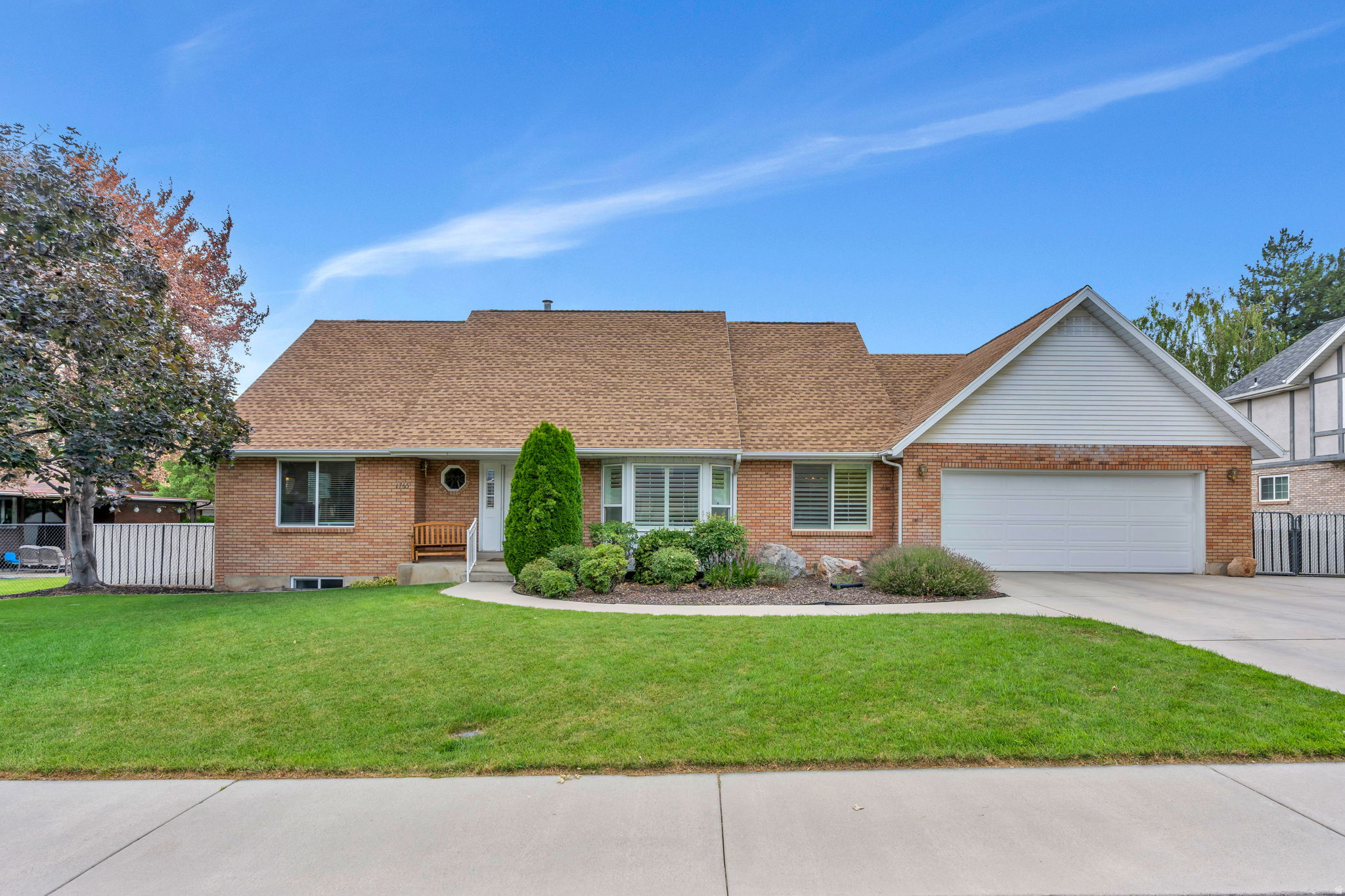 Charming brick 6-bedroom, 3.5-bath home in Provo's highly desirable Grandview neighborhood. This spacious home offers the convenience of main-level living, featuring a primary suite, laundry room, and office all on the main floor. Designed for both comfortable everyday living and entertaining, the home includes a large front living room, a cozy den with built-in bookshelves, an expansive basement family room, and two dining areas to accommodate large gatherings. Step outside to a large, flat backyard with a covered patio and automatic sprinklers-perfect for relaxing, gardening, or entertaining guests. Ideally located near UVU, Utah Valley Hospital, Westridge Elementary School, shopping, dining, and more. Lovingly maintained over the years, it provides a solid foundation with the opportunity to add your own style and updates.