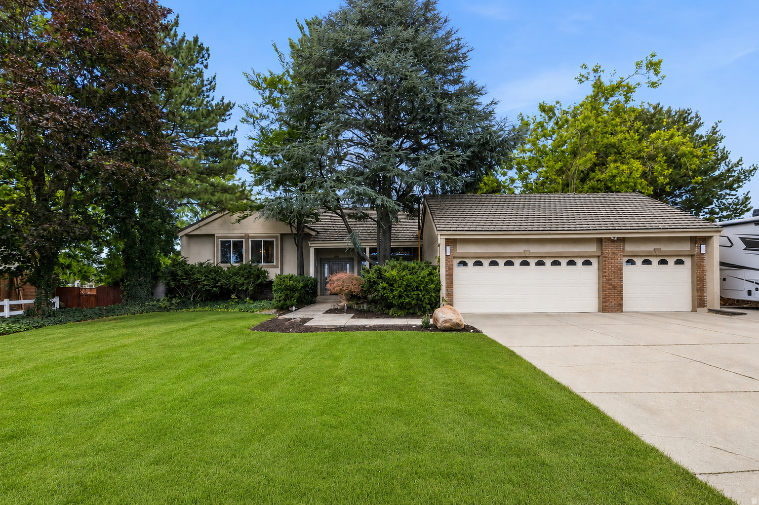 Beautifully updated home on a rare .32-acre lot backing a neighborhood park with private gate access. Recently appraised in June 2026 for $805k, this house is priced to sell. This move-in ready home features 5 bedrooms, 3 bathrooms, 2 fireplaces, an updated kitchen, remodeled bathrooms, newer carpet, fresh paint, a custom Trex deck, 3-car garage, paved RV parking, mature trees, and no HOA! The finished basement is all set up for an ADU rental with a seperate entrance, 2 beds, 1 den/office, 1 bath, kitchen and living space. Enjoy the privacy of an established neighborhood just minutes from Glenmoor Golf Course, The District, Jordan Landing, Bangerter Hwy, Mountain View Hwy, walking paths, schools, dining, and parks. A rare combination of over 4,000 sq feet, modern updates, flexible space, rental income and a killer location. Buyer to verify all information.