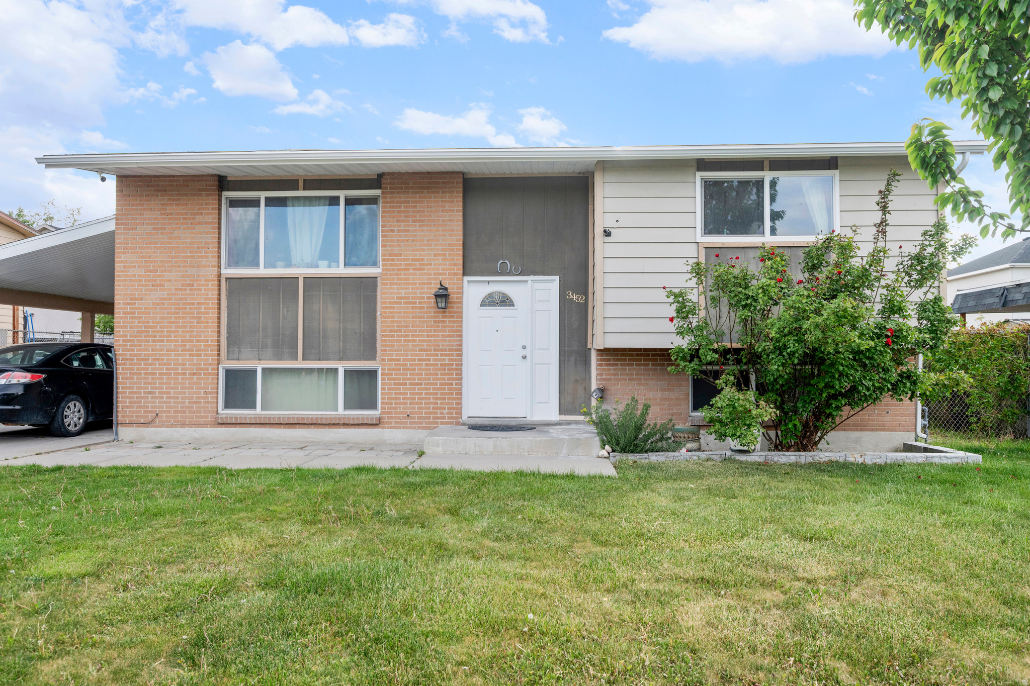 PRICE IMPROVEMENT! Split-level Magna home with space, updates, and all the extras you actually want. This 5-bedroom home features an open layout and a walk-out basement-perfect for flexible living, guests, or added income potential. Step outside to a large covered deck and patio area (with French doors leading right out) made for summer nights, entertaining, or just unwinding after a long day. The backyard is fully fenced, includes a dog run, and even has a fire pit. Inside, you'll find a gas stove, reverse osmosis system in the kitchen, canned lighting, and thoughtful updates throughout. Major upgrades have already been handled for you, including newer A/C, furnace, roof, updated soffit, rain gutters, and an updated carport. The newly expanded concrete parking gives you plenty of space for extra parking. The home features fruit trees, a cherry tree in the back and plumb in the front yard. Located with quick freeway access and just minutes from everyday essentials like Walmart and Rancho Market, and restaurants. Tenant occupied. Please submit showing requests at least 24 hours in advance.  Square footage figures are provided as a courtesy estimate only and were obtained from Tax records .  Buyer is advised to obtain an independent measurement.