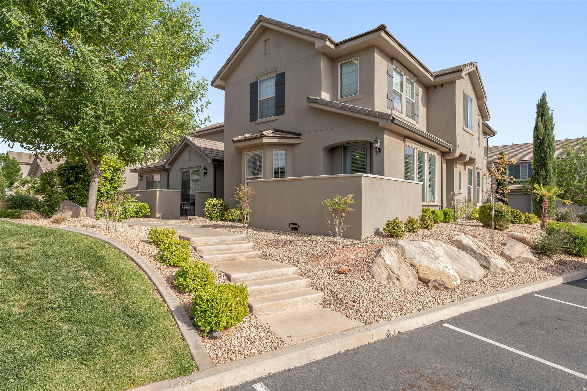Turnkey short-term rental in the highly desirable Casitas at Sienna Hills community of Washington, Utah. This fully furnished 3-bedroom, 2.5-bath home is zoned for nightly rentals and ready to generate income from day one. The open-concept main level features LVP flooring throughout, a bright living area with a bay window, and a well-appointed kitchen with white cabinetry, quartz countertops, a gas range, and an island with bar seating. Upstairs, the spacious primary suite includes an ensuite bathroom with dual sinks, a walk-in closet, and a separate soaking tub and tiled shower. Two additional bedrooms, a generous loft perfect for overflow sleeping or a second gathering space, and a full bathroom complete the upper level. The 2-car garage provides additional parking space and storage. Community amenities include a pool and hot tub, all covered by the HOA. Conveniently located off I-15 with quick access to Sand Hollow, Snow Canyon, Zion National Park, golf, dining, and shopping. Measurements provided as a courtesy only, buyer to verify all info.