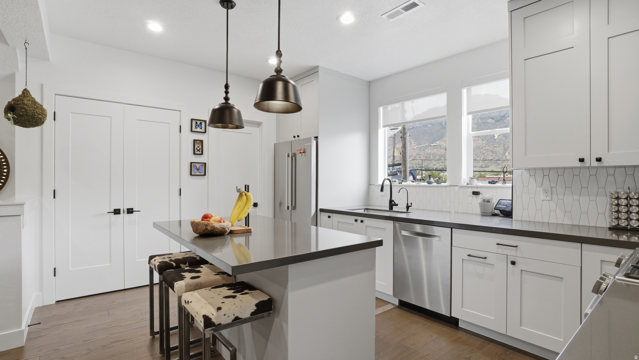 Rare 3-story rooftop townhome in the heart of Downtown Provo's Airbnb district. This modern 3 bed, 2.5 bath townhome offers 1,805 sq ft, a 2-car garage, and a private rooftop deck with incredible city and mountain views. Built in 2021, the home features a bright, open layout, modern finishes, and many upgrades throughout. Enjoy a highly desirable, walkable location near restaurants, shopping, BYU, Utah Valley Hospital, downtown amenities, and major transportation routes. A unique opportunity for an owner-occupant, second-home buyer, or investor seeking a rare downtown Provo property with strong lifestyle and income potential. This is a must-see property in one of Provo's most convenient and desirable downtown locations.