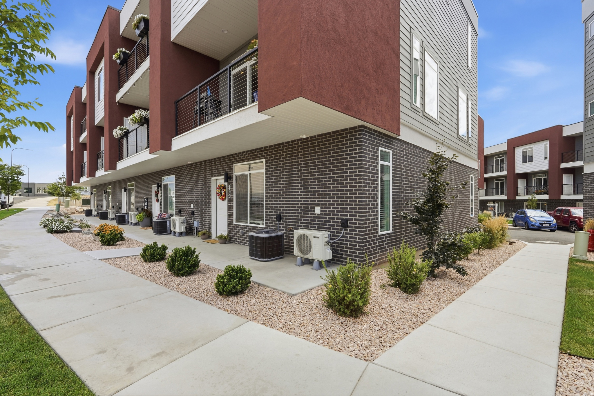Welcome to this stunning, modern row-end townhome in Clearfield offering low-maintenance living with incredible mountain views! Built in 2025, this beautifully finished 3-bedroom, 2.5-bathroom home boasts 1,627 square feet of thoughtfully designed living space. The open-concept main floor features sleek LVP flooring, high-end granite countertops, stainless steel appliances, and a smart thermostat for maximum comfort and energy efficiency. Upstairs, you will find three spacious bedrooms, including a primary suite with a walk-in closet and a primary bath with a separate tub and shower. Enjoy outdoor relaxation on your private balcony, take advantage of the attached two-car garage, and rest easy knowing the HOA covers exterior insurance, trash, snow removal, and landscaping. Conveniently located near local parks, schools, and major commuter routes, this turn-key home is ready for its next owner! -- Buyer to verify all information.