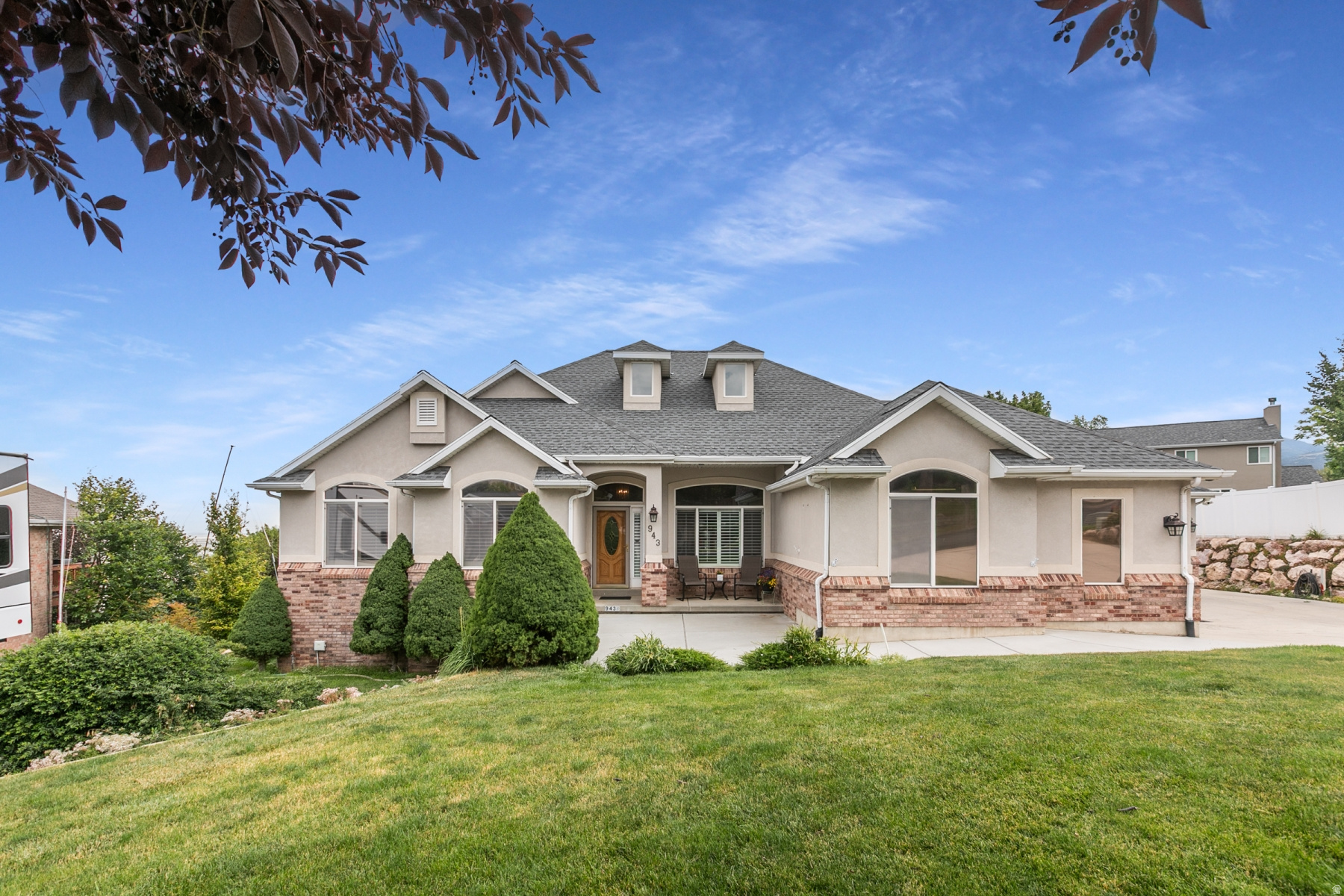 Luxury Executive Rambler in highly desired Eaglewood!  Located in one of the most sought-after neighborhoods, this beautifully maintained home showcases an open-concept design with vaulted ceilings, abundant natural light, and a gourmet kitchen that flows into the spacious living and dining areas. The luxurious primary suite offers a garden tub, separate steam shower and walk-in closet, while one of the main floor bedrooms can service as a den or office.  The fully finished walkout basement includes a second kitchen, cozy free-standing fireplace, daylight windows and space to add another bedroom, allowing for up to six bedrooms.  Two walkout lower-level entrances, including one to the single-car garage, provide flexibility for multigenerational living or guests. The oversized three-car garage features a workshop and workbench area.  Enjoy outdoor entertaining on the expansive three-tier deck overlooking the private backyard. Extra features include partially updated Anderson windows and a long extended RV pad.  Pool table, Gas BBQ Grill and TV's are negotiable.  This exceptional Eaglewood homes offers luxury, versatility, and outstanding value.  Don't miss the opportunity to make it yours!