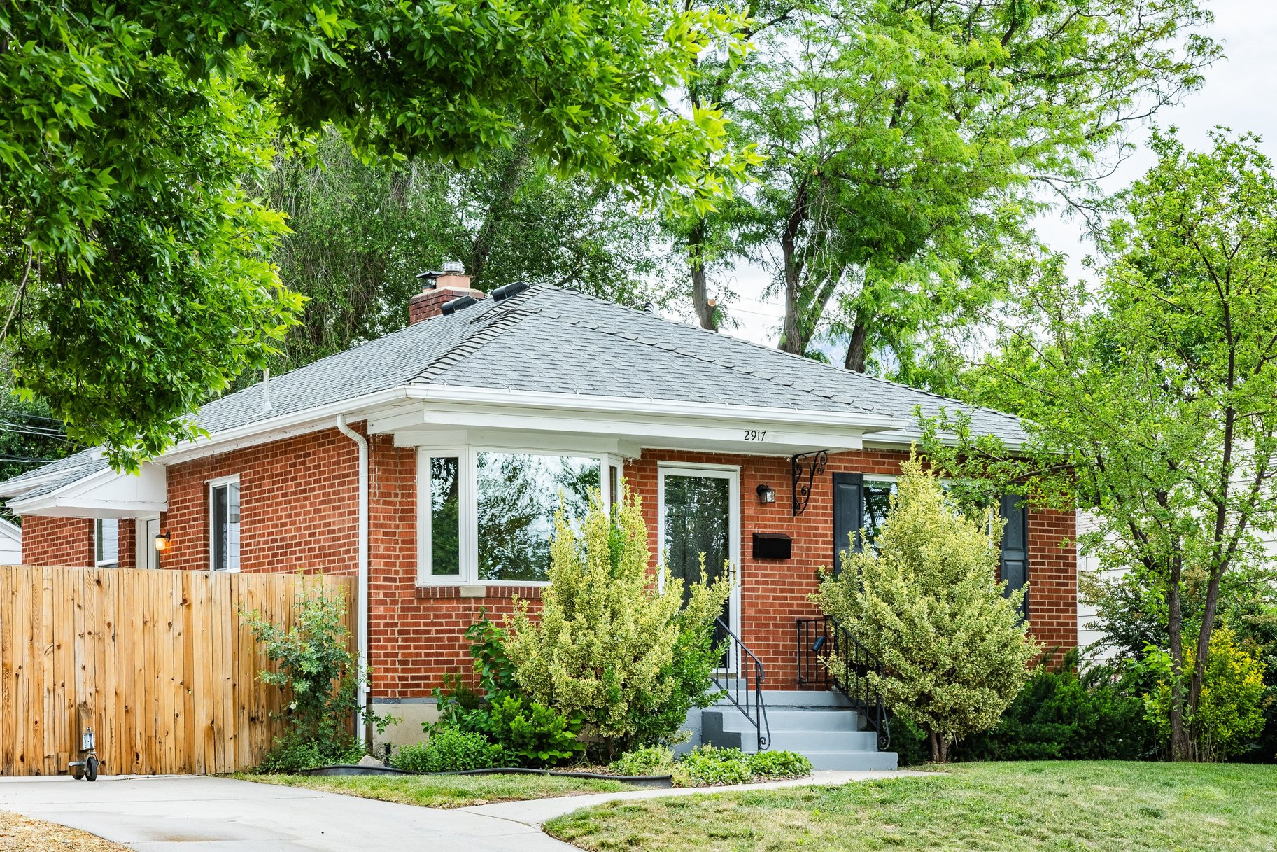 Welcome to this charming 3 bedroom, 2 bathroom bungalow nestled in the heart of Sugar House. Full of warmth, character, and thoughtful updates, this home blends cozy interior living with incredible outdoor spaces designed for gathering, relaxing, and entertaining. Step inside to beautifully refinished hardwood floors, abundant natural light, and renovated bathrooms that bring a fresh, timeless feel to the home. Major system updates provide peace of mind including a new furnace, A/C, water heater, and whole-house steam humidifier all completed in 2021. New windows throughout the main floor add comfort and efficiency while preserving the home's classic bungalow charm. Out back is where this home truly shines. Enjoy summer nights on the spacious Trex deck and patio, host friends around the firepit, or unwind in the private backyard surrounded by updated fencing and mature landscaping. Whether it's slow mornings with coffee or evenings filled with conversation and string lights, this yard was made for outdoor living. Additional upgrades include a garage door update in 2024, making this home as functional as it is inviting. Located just minutes from Sugar House parks, restaurants, shopping, and local favorites, this is the perfect blend of comfort, charm, and lifestyle.