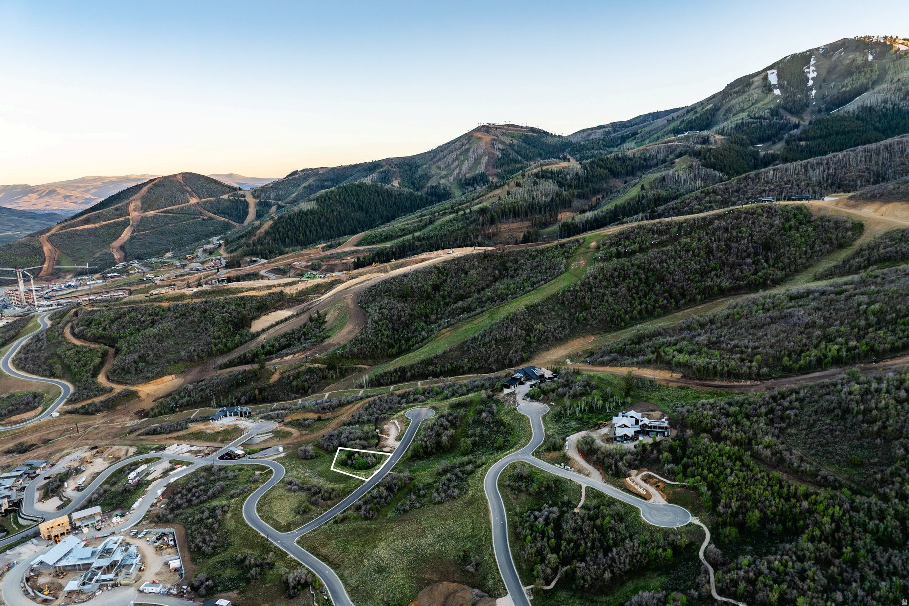 One of Velvaere's final premier ski-in, ski-out homesites, this three-quarter-acre downhill lot is perfectly positioned along a private ski trail with seamless access to Deer Valley Resort. Capture breathtaking views stretching across the Jordanelle Reservoir and Deer Valley's newest terrain from a homesite offering a generous building envelope, gentle topography, and protected view corridors.  Tucked behind the gates of Velvaere, owners enjoy a rare balance of adventure and retreat. Enjoy direct access to the Neptune Express high-speed chairlift, skiing straight to the lift, bypassing crowded base areas, plazas, and day-skier traffic. Membership at Club Velvaere unlocks a unique collection of private amenities, including two clubhouses, a ski beach with ski and bike valet and aprs lounge, year-round pools and hot tubs, Technogym fitness, wellness and recovery experiences, concierge services, private shuttle transportation, and a boat club on the Jordanelle Reservoir.  With ski access already operational and clubhouse amenities anticipated to debut in 2027, the opportunity to secure one of Velvaere's remaining ski homesites is rapidly disappearing. Build a legacy mountain estate at the forefront of Deer Valley East Village's transformative evolution. Additional estate homesites and luxury residences are available.