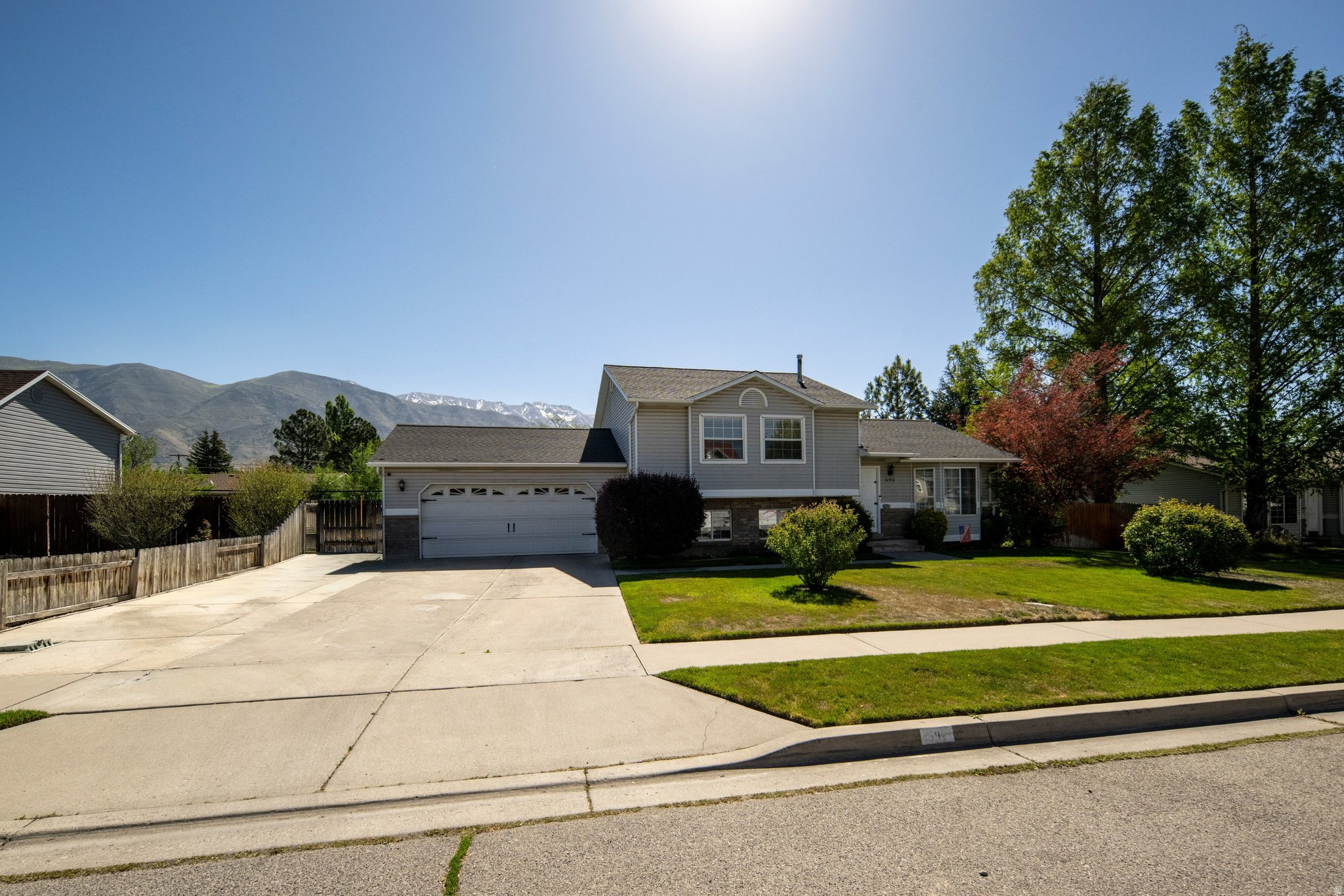 This inviting tri-level home is in a prime American Fork location! Six bedrooms provide room for everyone, including a cozy basement bedroom currently being used as an office space. Built in 1993, the home features a generously sized primary suite, new laminate flooring in the basement, and a water heater that is only one year old. Enjoy the fully fenced backyard with mature trees and plenty of space to relax, garden, or entertain. Conveniently located near American Fork High School with quick access to shopping, dining, freeway connections, and the outdoor recreation of American Fork Canyon for hiking, biking, and exploring. NOTE: Square footage total taken from county records.  As a tri level the main floor and top floor square footage is estimated based on the total above grade square footage taken from county records.  The buyer is encouraged to verify square footage.