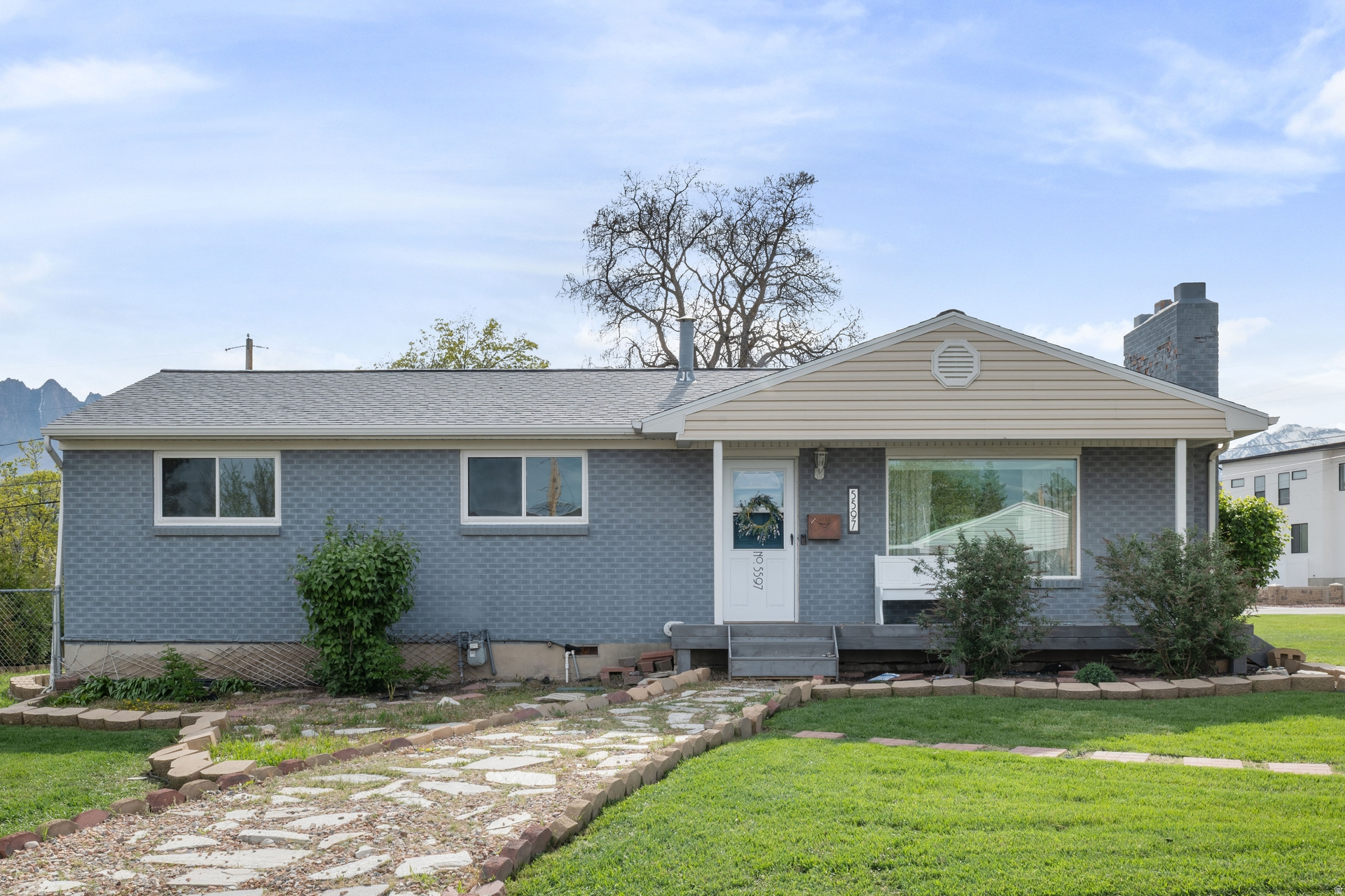 This charming 5 bedroom, 1.75 bath home is now available and showcases beautiful builtins along with thoughtful updates throughout. Featuring quartz countertops, stainless steel appliances, original hardwood floors, and numerous upgrades, the home blends classic character with modern comfort. The extra deep detached 2 car garage includes a workbench and is complemented by adjacent RV parking, providing ample space for vehicles, storage, and recreational toys. Ideally located near shopping, restaurants, I-15 and schools, the property also offers peace of mind with recent improvements including a newer HVAC system, roof, sound-proof windows, and sewer main line.  Enjoy entertaining on the covered deck while taking in mountain views, or relax indoors by one of two cozy fireplaces. This well maintained home offers both charm and convenience in a highly sought after location. The "sea breeze" colored cabinet in the breakfast nook is not included. Square footage figures are provided as a courtesy estimate only and were obtained from tax records. Buyer is advised to obtain an independent measurement.