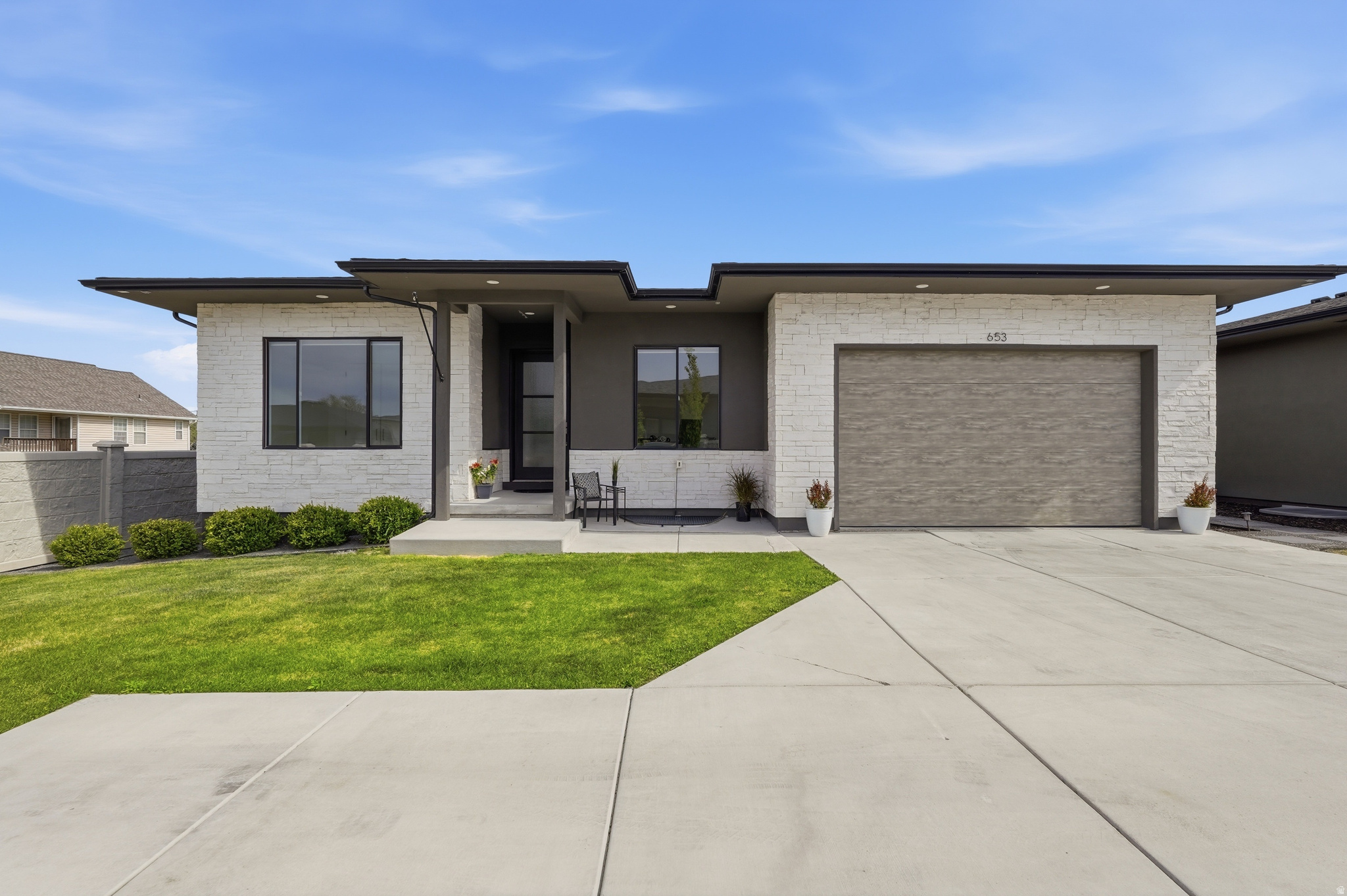 Beautiful new listing in the prestigious 6th Street Cottages of Draper! Tucked privately at the end of a cul-de-sac, this dream home is a true masterpiece featuring a spacious open floor plan filled with abundant natural light, elegant living spaces, and high-end finishes throughout. Designed for both luxury and entertaining, the gourmet kitchen boasts top of the line appliances and a butler pantry for added convenience. Multi-slide door out to the private deck with gas line ready for use. Top down bottom up roller shades for extra privacy but allowing the beautiful light to come in. The luxurious primary suite offers a spa-like retreat with a relaxing soaking tub and private ambiance. Downstairs, the expansive family room provides endless possibilities for a theater set up, game room, or ultimate rumpus room. Electric vehicle charging station installed. An exceptional home in one of Draper's most desirable locations.