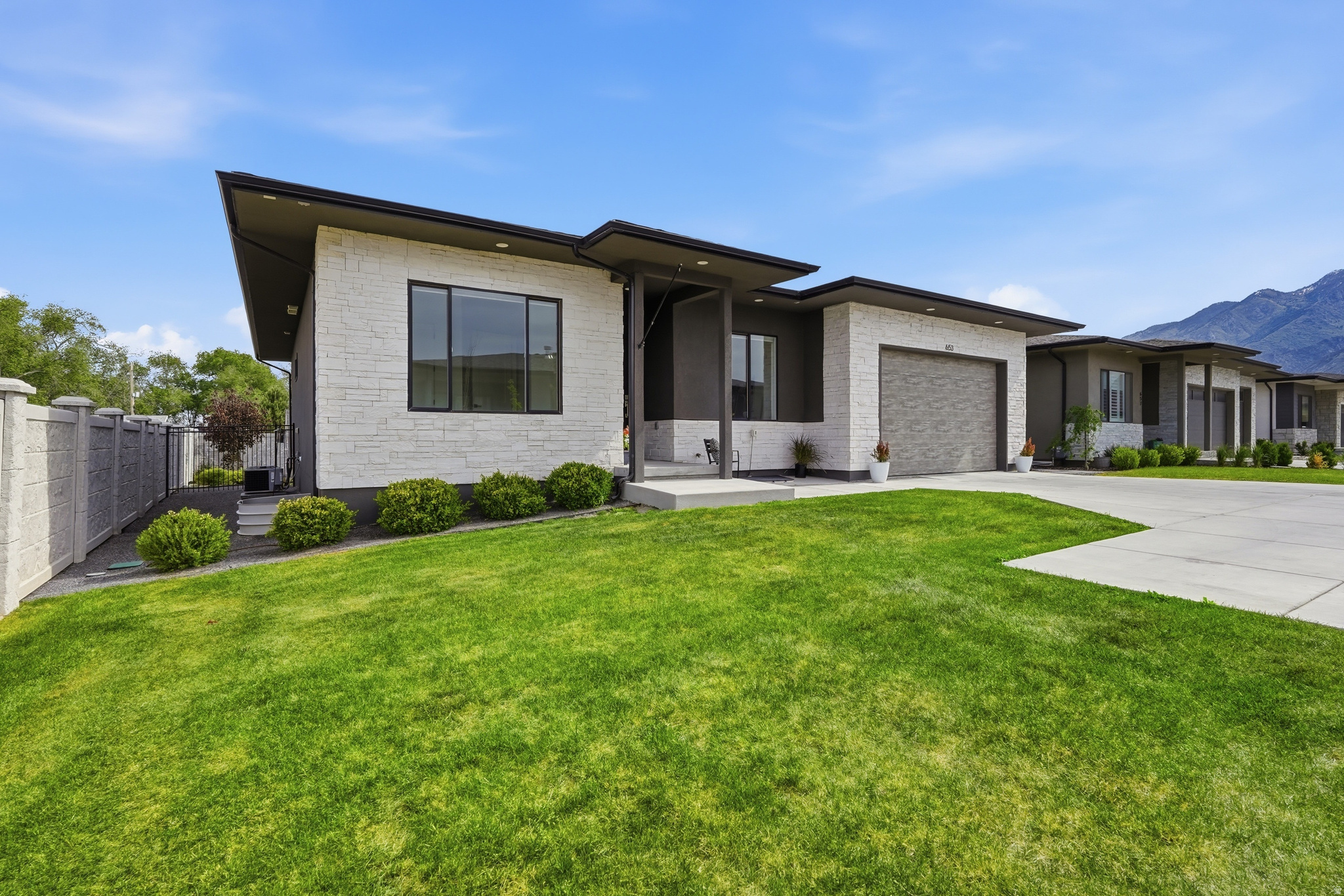 Beautiful new listing in the prestigious 6th Street Cottages of Draper! Tucked privately at the end of a cul-de-sac, this dream home is a true masterpiece featuring a spacious open floor plan filled with abundant natural light, elegant living spaces, and high-end finishes throughout. Designed for both luxury and entertaining, the gourmet kitchen boasts top of the line appliances and a butler pantry for added convenience. Multi-slide door out to the private deck with gas line ready for use. Top down bottom up roller shades for extra privacy but allowing the beautiful light to come in. The luxurious primary suite offers a spa-like retreat with a relaxing soaking tub and private ambiance. Downstairs, the expansive family room provides endless possibilities for a theater set up, game room, or ultimate rumpus room. Electric vehicle charging station installed. An exceptional home in one of Draper's most desirable locations.