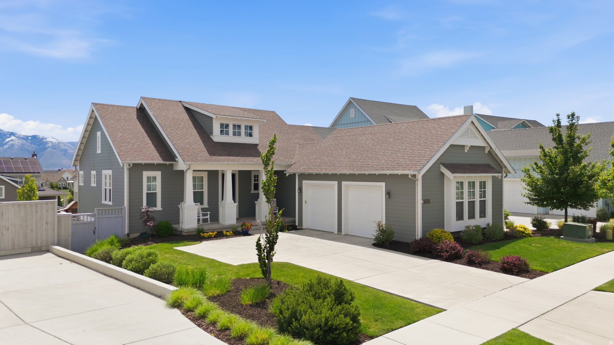 *OPEN HOUSE Saturday, May 23rd 2pm-4pm* One of the premier lots in Daybreak, this rare .21-acre property sits just one block from Oquirrh Lake and offers a flat, pool-ready backyard with lake and mountain views, expansive windows, and incredible natural light throughout. Located within walking distance to trails, parks, waterfront paths, the new Harmons, shopping, dining, and Daybreak's expanding downtown district, this home delivers one of the community's most sought-after lifestyle locations. Designed for indoor-outdoor living, the backyard features a gorgeous green space, natural stone exterior, elevated deck overlooking the lake & mountain views, hot tub, and direct walkout basement access. Inside, the main level features 10+ ft ceilings, a floor-to-ceiling natural stone fireplace, mudroom, dedicated desk area, and open-concept living. The kitchen includes a large island, double oven gas range, and generous storage. The main-floor primary suite offers dual sinks, separate soaking tub and shower, and a large walk-in closet. The daylight walkout basement includes 3 additional bedrooms, full bath, 9-ft ceilings, expansive second living area, cold storage, and plumbing for a future second bathroom. Exceptional lot, views, and location complete this standout Daybreak property.