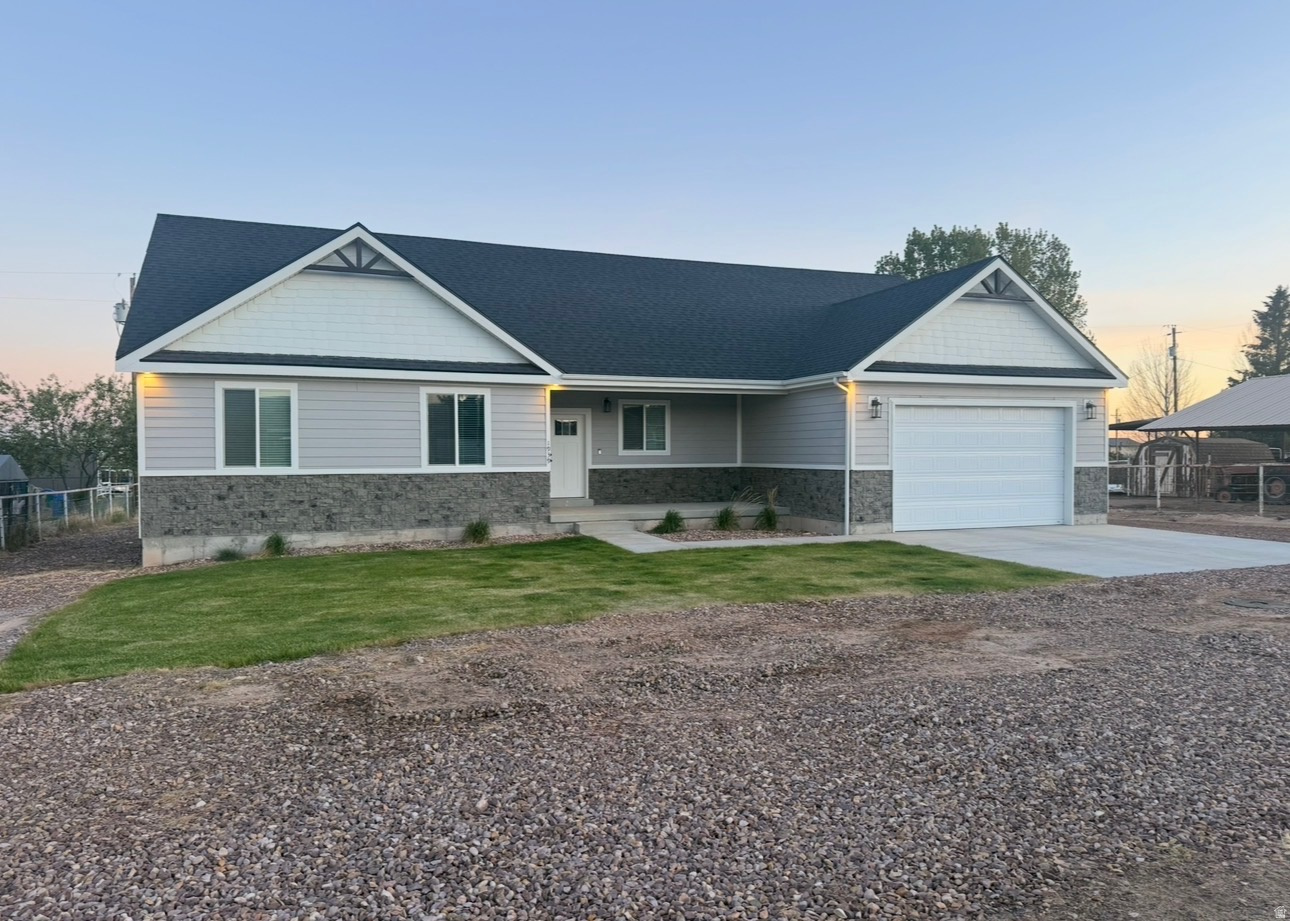 Custom home Only 1 1/2 years old, built on a quiet Street and has granite countertops, Huge Pantry, 2 car Garage, large master bath, sprinkler system, walking distance from Neola Elementary.  This beautiful home is like new and is move in ready.  Square footage figures are provided as a courtesy estimate only and were obtained from plans.  Buyer is advised to obtain an independent measurement. Gas appliances run on propane.  There is a large crawl space, approximately 4 feet tall under most of the house for storage, play room, etc..