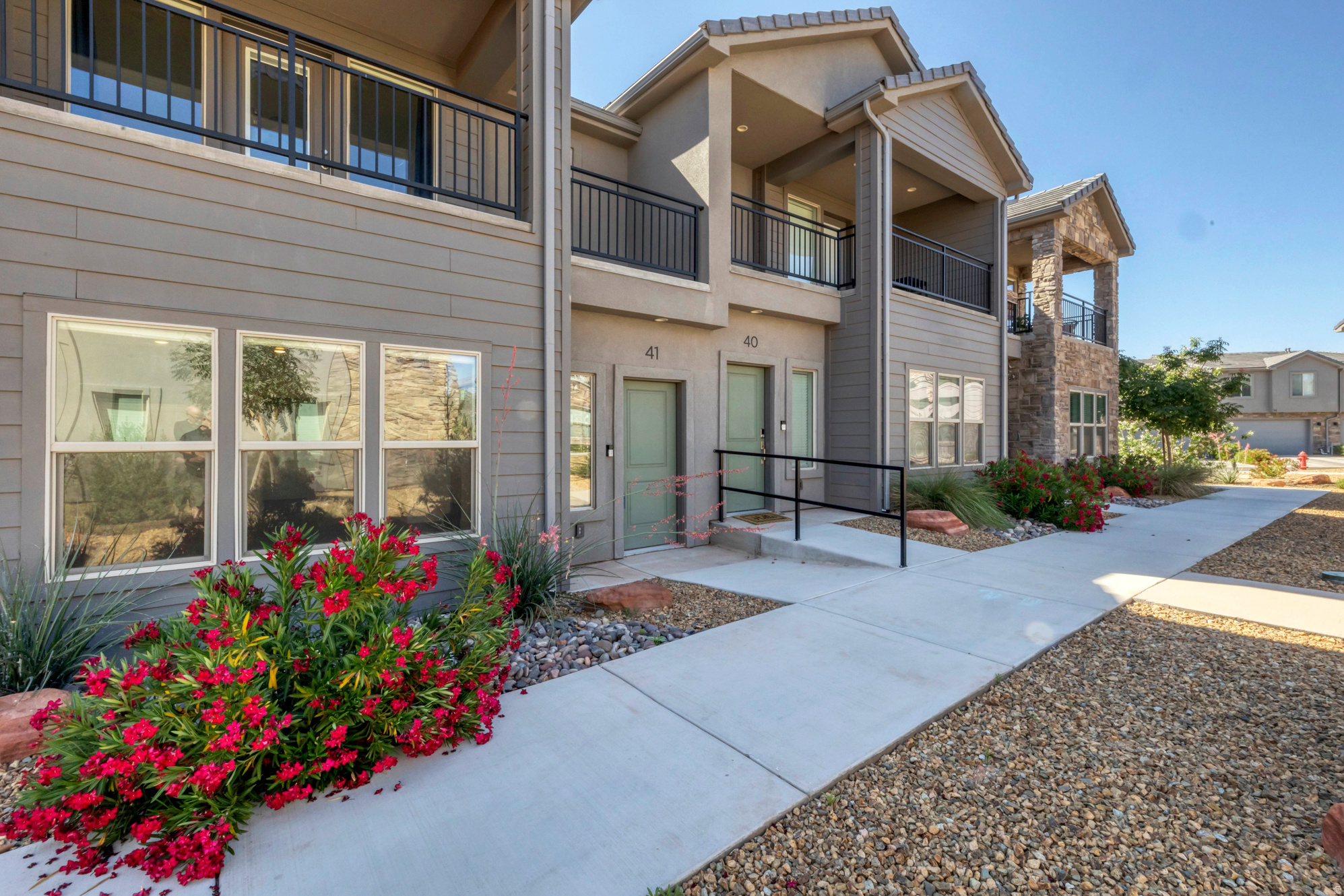 Stunning Modern Townhome in Ivins! Welcome to this nearly-new 1,652 sq. ft. two-story townhouse located in the desirable Azalea Townhomes community. Built in 2022 and priced at $418,000, this residence offers a contemporary lifestyle with 3 spacious bedrooms and 3 bathrooms. The thoughtful layout features 826 sq. ft. on the main level and another 826 sq. ft. on the second story, providing a perfect balance of open living space and private quarters. The primary suite serves as a true retreat, featuring a private attached balcony perfect for enjoying the fresh air and stunning local views. The interior is designed for comfort and modern convenience, boasting central electric air conditioning and forced air heating. This home is exceptionally turn-key, as the sale includes a brand-new fridge, washer, and dryer, along with a microwave and all window shades. For added utility, the property features soft water hookups that are already installed and ready for immediate use. Parking and sustainability meet in the 2-car deep carport/garage, which comes equipped with an electric car charger outlet already in place. Residents of Azalea Townhomes enjoy premier community perks, including access to a sparkling pool and relaxing spa. The $153 monthly HOA fee covers these amenities while maintaining the community's high standards. Located in the Washington School District, this property is zoned for Red Mountain Elementary and the highly-regarded Snow Canyon High School. Whether you are seeking a primary residence or a low-maintenance getaway near the red rocks, this Ivins gem is an incredible opportunity. Square footage figures are provided as courtesy estimates only and were obtained from county records. Buyer is advised to obtain an independent measurement.