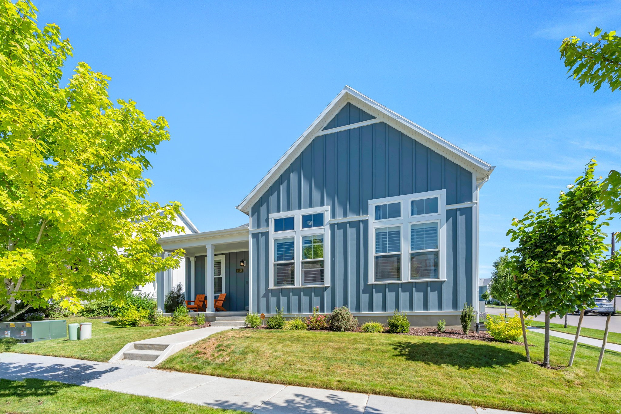 Welcome to this beautifully maintained Daybreak rambler, ideally located just one block from the Watercourse and only minutes from Oquirrh Lake, the Daybreak Library, parks, trails, and all the amenities that make Daybreak such a sought-after community.  Step inside to a bright and inviting open-concept living space filled with natural light. The living room features recessed lighting and a unique bookshelf divider wall that adds both character and functionality while maintaining an open, airy feel. Warm wood-look flooring flows throughout the main living areas, creating a cohesive and welcoming atmosphere.  The pristine kitchen is designed for both everyday living and entertaining, featuring stylish two-tone cabinetry, stainless steel appliances, an updated refrigerator, a vented gas range, and a generous pantry with ample storage space.  The adjoining dining area is bright and spacious, enhanced by the charming bookshelf privacy wall and direct access to the backyard, making indoor-outdoor living a breeze.  Outside, you'll find a fully fenced backyard complete with raised planting boxes and lush lawn space, providing the perfect setting for gardening, pets, playtime, or relaxing with family and friends.  The light-filled primary suite offers a peaceful retreat with direct access to the ensuite bathroom. The spacious ensuite features dual vanities, a walk-in closet, a soaking tub, and a separate walk-in shower.  Enjoy all that Daybreak has to offer, including Oquirrh Lake, over 30 miles of walking and biking trails, community pools, fitness facilities, parks, playgrounds, community gardens, year-round events, and convenient access to shopping, dining, and entertainment.  This charming rambler combines comfort, style, and an unbeatable location in one of Utah's premier master-planned communities.
