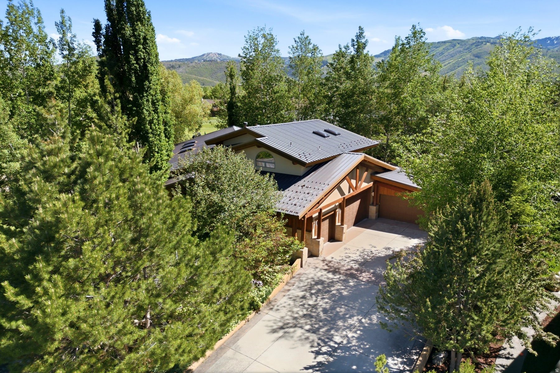 Fabulous home on golf course with ski area views  Experience elevated mountain living in one of Park Meadows' most coveted locations. Perfectly positioned along the 17th fairway of the Park Meadows Golf Course, 6 St Andrews Court offers breathtaking views of Deer Valley's iconic Bald Mountain and an exceptional combination of privacy, luxury, and convenience.   Surrounded by the natural beauty of Park City, this stunning residence provides easy access to miles of hiking and biking trails, world-class ski resorts, Historic Main Street, top-rated schools, dining, shopping, and entertainment. With complimentary transit nearby and one of Park City's most desirable addresses, Park Meadows continues to be a premier choice for both full-time residents and second-home owners.   Designed for effortless entertaining and comfortable everyday living, the home features soaring vaulted ceilings, expansive windows, and a flowing open-concept floor plan that seamlessly connects indoor and outdoor spaces. Enjoy spectacular mountain and golf course views from the grand living room, sun-filled breakfast nook, expansive deck, private terrace, and relaxing hot tub.   The chef's kitchen is equipped with a professional-grade range, double ovens, abundant workspace, and generous storage, while multiple gathering areas throughout the home create the perfect setting for hosting family and friends. The lower level offers additional recreation and entertaining space complete with a wet bar, lounge area, and room for a private fitness studio.   One of the property's most remarkable features is its oversized garage and flexible bonus space. Whether utilized for multiple vehicles, a golf simulator, a luxury lounge, a game room, a workshop, or a custom entertainment venue, the possibilities are virtually endless.   The private primary suite serves as a luxurious retreat, offering a dedicated office, sauna, soaking tub, dual vanities, and an oversized walk-in closet. Thoughtfully designed, this exceptional Park Meadows residence delivers the ultimate Park City lifestyle-where championship golf, world-class skiing, outdoor adventure, and refined mountain living come together in one extraordinary home.