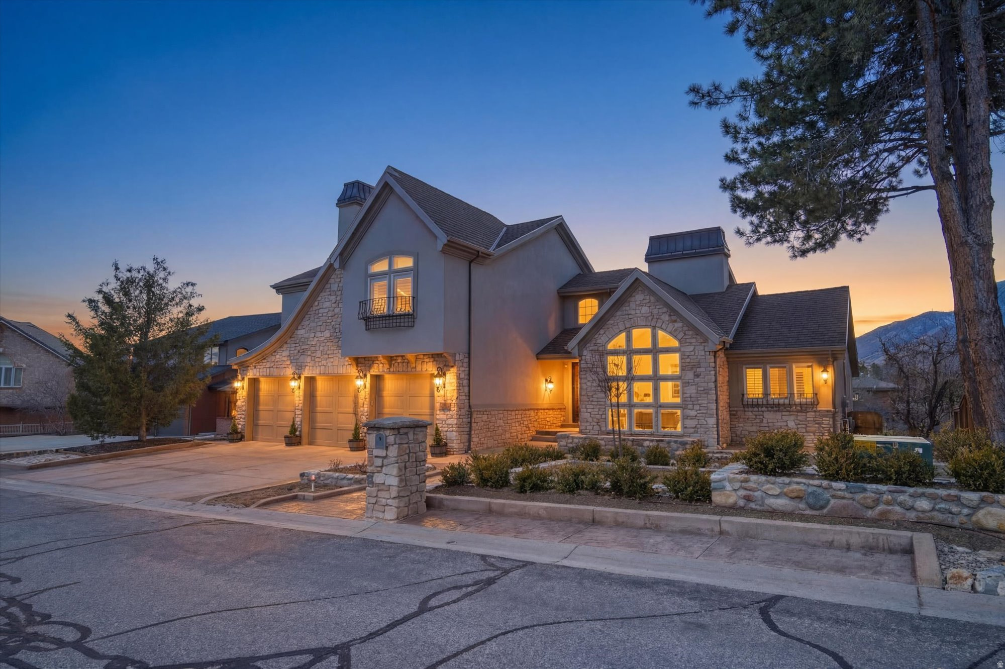 Rarely do homes offer this combination of privacy, views, and convenience - just minutes from the world class skiing of Alta, Snowbird, Brighton and Solitude, and approximately 20 minutes to Salt Lake City International Airport.       Perched on a spectacular half-acre homesite with sweeping views of both the valley and the mountains, this stunning 2024 remodeled residence offers refined luxury, exceptional space, and extraordinary indoor-outdoor living.   Featuring 5 bedrooms and 5 bathrooms across 3 beautifully designed levels, the home combines timeless architecture with sophisticated modern upgrades. The completely new chef's kitchen is a show piece, highlighted by soaring custom cabinetry, high end finishes, top of the line appliances, and generous space for gathering and entertaining. Brand new hardwood floors flow throughout the main living areas, brining warmth and elegance to every room.   Expansive windows frame the breathtaking scenery, filling the home with natural light and showcasing the natural setting.  The thoughtfully designed lower level includes a separate entrance and a full kitchen offering flexibility for guests, multi -generational living, or potential rental opportunities.   Outside, the incredible professionally designed yard is a true sanctuary, featuring stone walls, raised beds, mature plantings, and inviting outdoor spaces perfect for relaxing or entertaining while enjoying the panoramic surroundings.   Perfectly located just 20 minutes from four world-class ski resorts, and 20 minutes from the international airport, this home offers the rare combination of mountain access, convenience, and luxury living.   Cottonwood Height is a wonderful small city with a separate police force, and a beautiful recreation center with pools and an ice rink. Pay no mind to the mess on Deer Creek Road as you enter, huge water pipes were just installed and soon all the homes will have lovely landscaping, just as they did before. Home was appraised 3 months ago for $2,200,000.