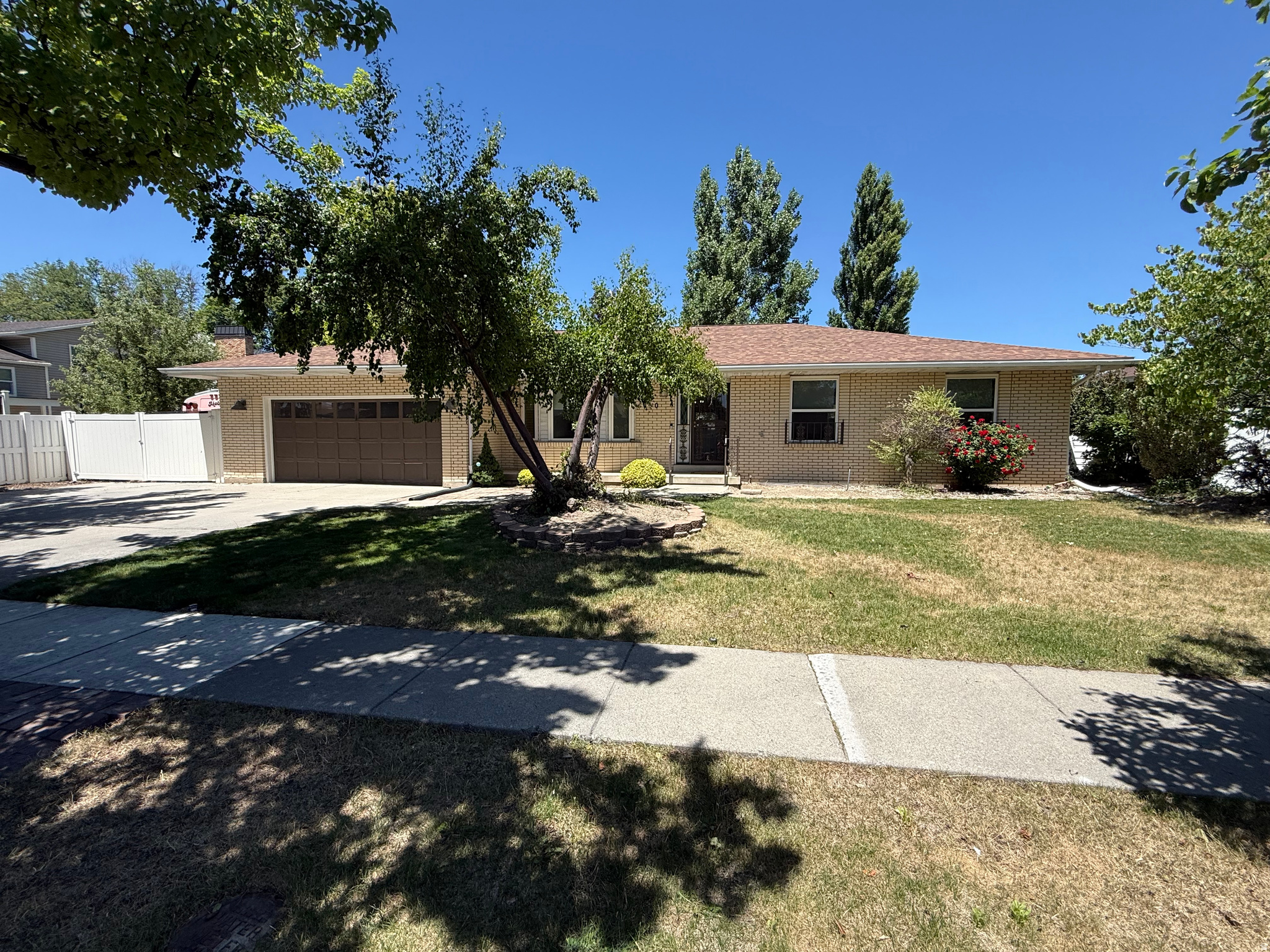 This beautiful, well cared for classic rambler is located on a lovely tree-lined street in a very desirable Murray neighborhood. You will love the gorgeous custom kitchen complete with SS KitchenAid appliances, glowing granite countertops, ample work spaces and tons of storage! It connects to a welcoming family room with a cozy gas fireplace and access to the lovely backyard. There are newer windows upstairs, a newer roof, dryer, blinds, water heater and smart sprinkler system. You will love relaxing on the covered patio after a long day and or entertaining family and friends there. The basement has a fun family room with cool retro wet bar and wood burning stove.  There is also an awesome craft room that has laundry hookups & a fantastic workshop ready for your projects.  This home has been loved and the neighborhood has been cherished as well.  This is a rare find in this wonderful Murray community.  Come and see it today!