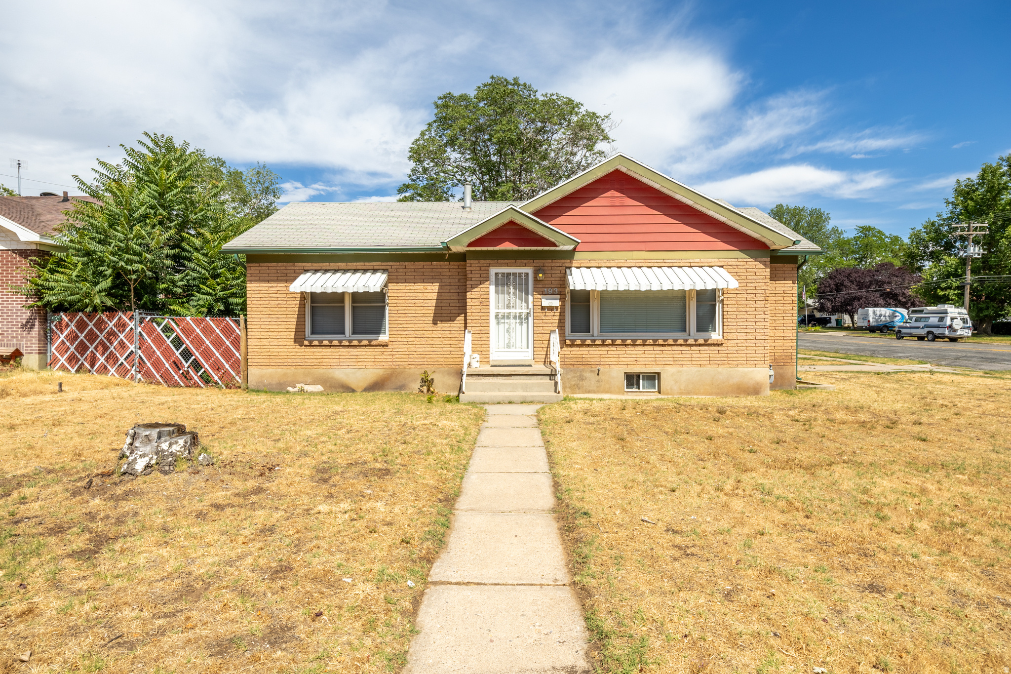 Welcome to this well-maintained 3-bedroom, 2-bathroom home in the heart of Clearfield! Situated on a large corner lot, this home offers a functional layout with plenty of natural light throughout, hardwood flooring, a 2-car garage, and additional driveway parking. Conveniently located near shopping, dining, parks, public transportation, and Hill Air Force Base, this home also includes solar panels to help reduce monthly electric costs. Square footage figures are provided as a courtesy estimate only and were obtained from county records. Buyer is advised to obtain an independent measurement.