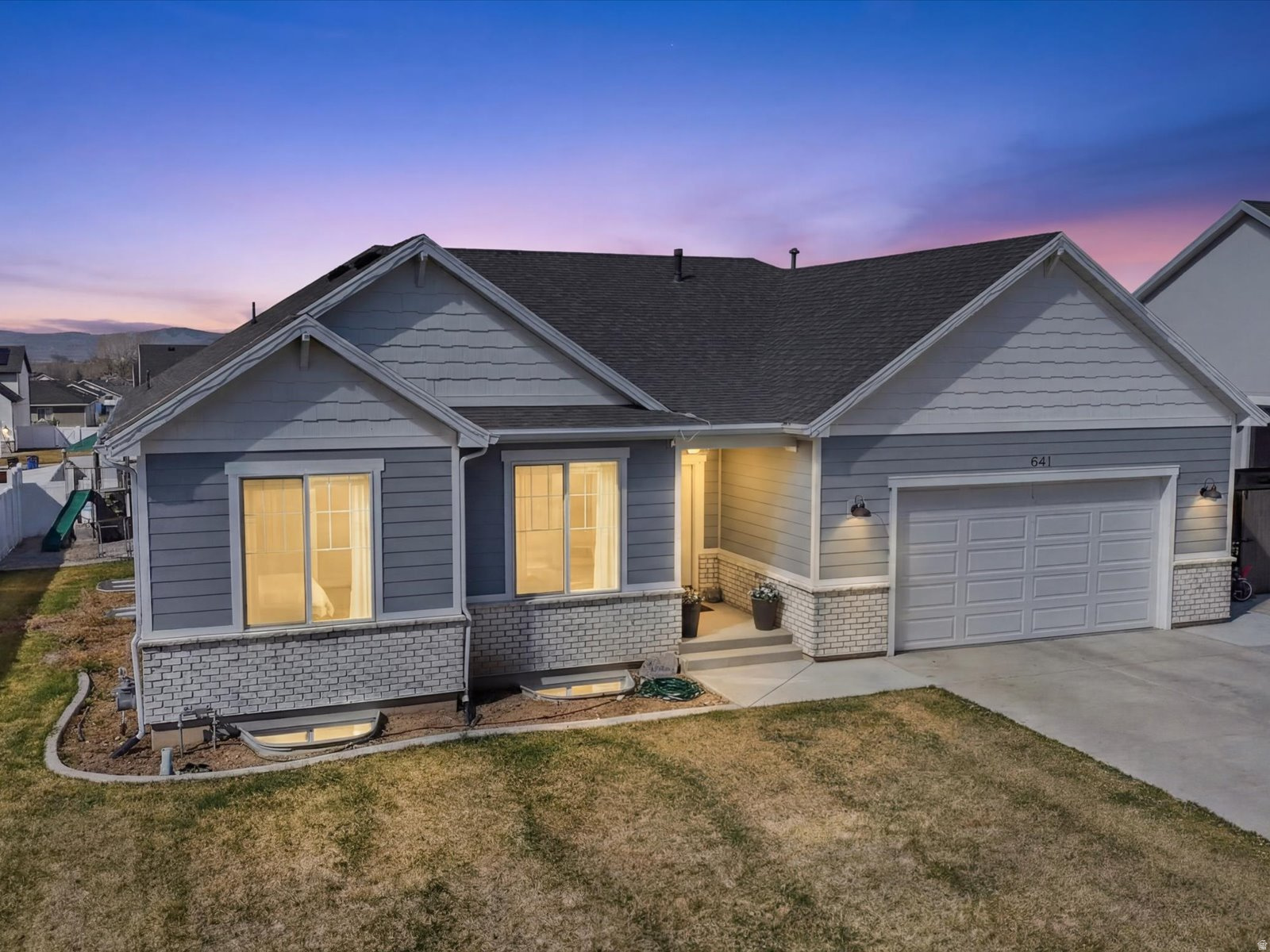 Built in 2022, this beautifully maintained 5-bedroom, 4.5-bath home offers the perfect combination of modern construction and move-in-ready convenience. Why wait to build when you can own a nearly new home with a fully finished basement, completed landscaping, and a finished yard already in place? Conveniently located near schools, restaurants, grocery stores, golf, and other everyday amenities, this home provides both comfort and accessibility. The inviting interior features modern finishes and fixtures throughout, creating a warm and welcoming atmosphere. The spacious floor plan includes 3 bedrooms and 2.5 bathrooms on the main and upper levels, plus 2 additional bedrooms and 2 bathrooms in the recently completed basement. The basement is also plumbed for a future wet bar or kitchenette, providing flexibility for entertaining, guests, or multigenerational living. Step outside to the large west-facing deck and enjoy breathtaking Cache Valley sunsets from your own backyard. This is a rare opportunity to own a nearly new, fully finished home while avoiding the cost, delays, and hassle of finishing a basement or landscaping a yard. Schedule your private showing today! Buyer to verify all information.
