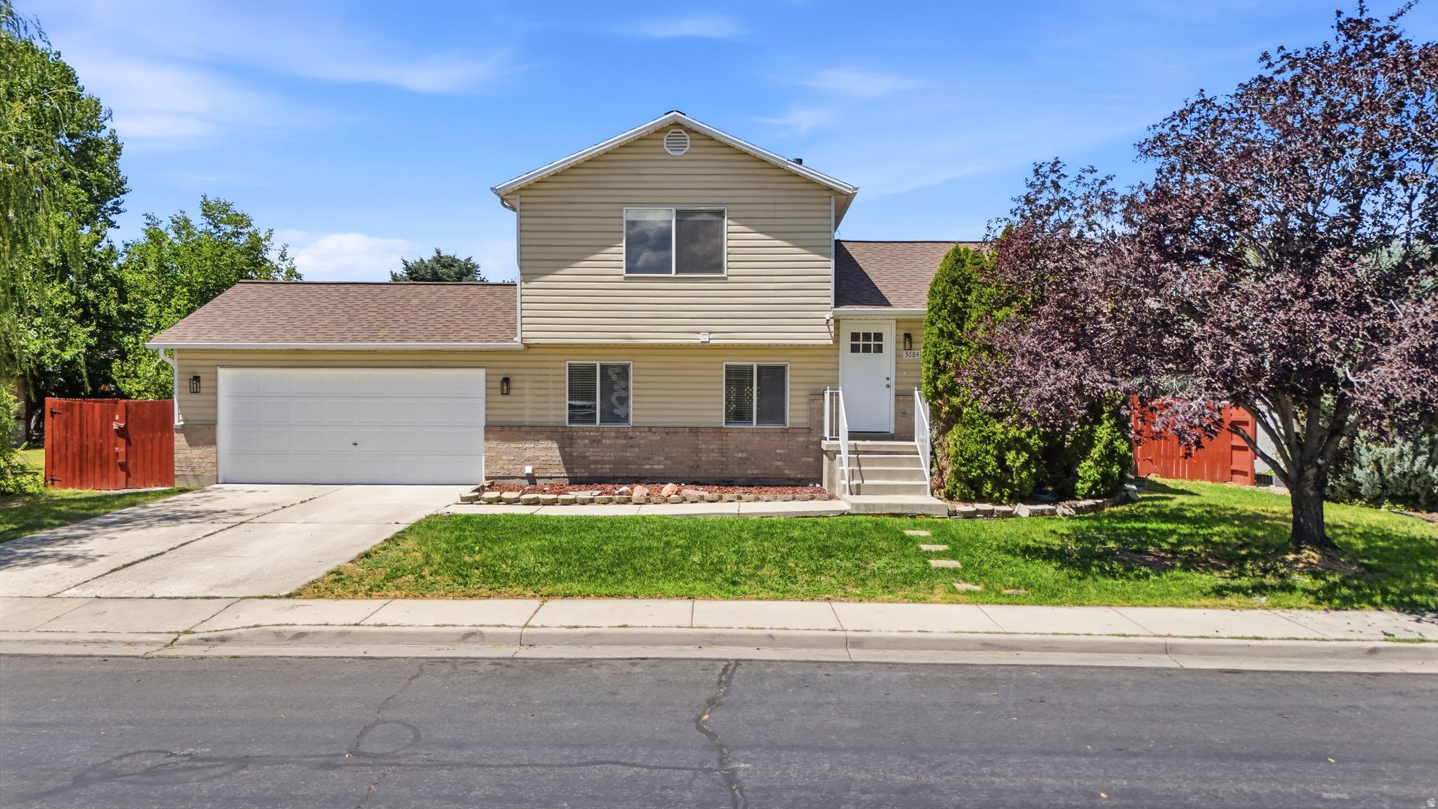 Updated and move-in ready, this beautiful split-level home combines modern finishes with an unbeatable location. Filled with natural light, the open and inviting floor plan features new flooring, fresh paint, recessed lighting, an updated kitchen with quartz countertops, breakfast bar seating, and an adjacent dining area overlooking the backyard and the spacious lower-level family room perfect for relaxing or entertaining. The refreshed bathroom offers timeless finishes, while outside you can enjoy a large fully fenced backyard with mature trees, storage shed, wiring for a future hot tub, and plenty of room for gatherings, pets, or play. Ideally located just steps from Kingspointe Park and playground, minutes from Meadow Brook Golf Course, the Jordan River Trail, and convenient access to both I-215 and I-15. Enjoy being less than 20 minutes from Millcreek Canyon, I-80 accessing world-class skiing in Park City, and Salt Lake City International Airport. This is the updated home, spacious yard, and central location you've been waiting for.