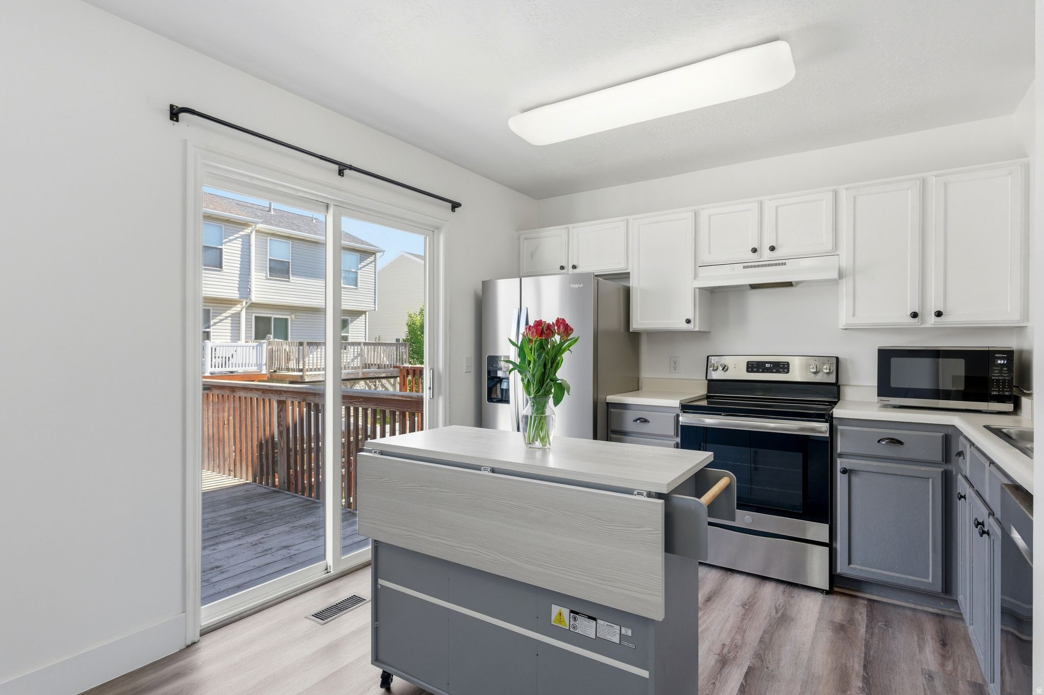 Welcome to this charming, move-in-ready townhome that blends comfort and style in all the right ways. From the moment you step inside, you'll feel the warmth of a layout designed for easy living. The open floor plan offers space for entertaining or room for relaxing. Enjoy peace of mind with major improvements already taken care of-including a new roof (2020) , A/C (2023), flooring (fall 2024), and all appliances except the oven-so you can focus on settling in and making it your own. The main-floor flex room adds incredible versatility, perfect for a home office, guest space, another bedroom, exercise room, etc.. With quick access to shopping, dining, Hill Field, Clearfield Front Runner station, and I-15, this home makes everyday living effortless. Whether you're a first-time buyer, downsizing, or looking for a low-maintenance lifestyle, this one checks all the boxes. Come see it today!   Square footage figures are provided as a courtesy estimate only and were obtained from public records.  Buyer is advised to obtain an independent measurement.