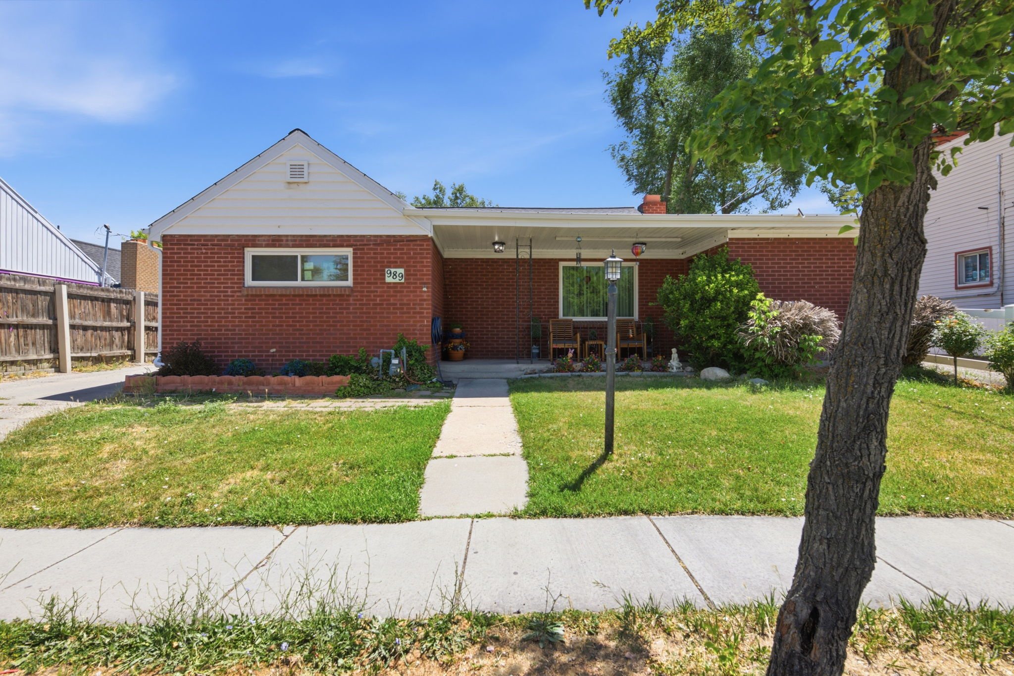 Wonderful 3 bedroom 1 bathroom home. Room to grow in the basement. Over 2400 sqft! Basement has a toilet. SPACIOUS Single Car Detached Garage with workshop. FANTASTIC SHE SHED with POWER and Solar Panel. Area for dog run. Newer roof (Sept. 2022) and TWO furnaces. Street facing windows replaced Sept. 2022.  Across the street from Jordan Park and Peace Gardens.  **This listing includes Tax ID 15-11-402-002-0000 (driveway) and 15-11-402-014-000 (home).   Square footage figures are provided as a courtesy estimate only and were obtained from Salt Lake County Assessor.  Buyer is advised to obtain an independent measurement.