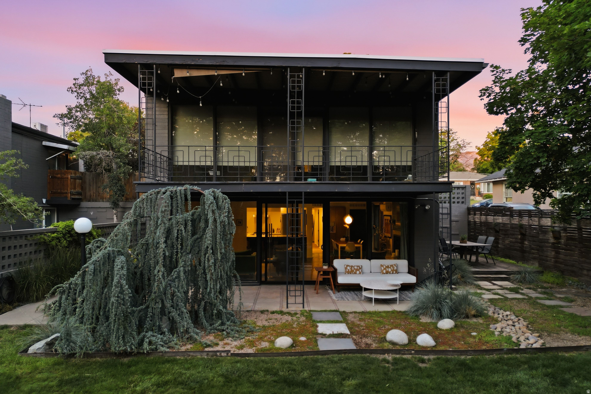 Tucked just off Brickyard this 2-bed, 2-bath residence is a study in considered design. Polished concrete floors anchor the space with an industrial cool that gives way to warm mid-century lines - the kind of home that stops people in their tracks. At 1,348 square feet, the layout lives large. Oversized windows flood the interior with natural light. The walk-out access connects seamlessly to a private patio with a dedicated BBQ area followed by an incredible shared backyard space with large mature landscaping- equal parts retreat and entertaining stage. High-end appliances and in-unit laundry round out a home that's as functional as it is striking. 2 Large storage closets for all your outdoor gear and quick freeway access means the whole valley is within easy reach, without sacrificing the neighborhood feel that makes this location special. This is a rare find for the design-forward buyer who wants something with real character.