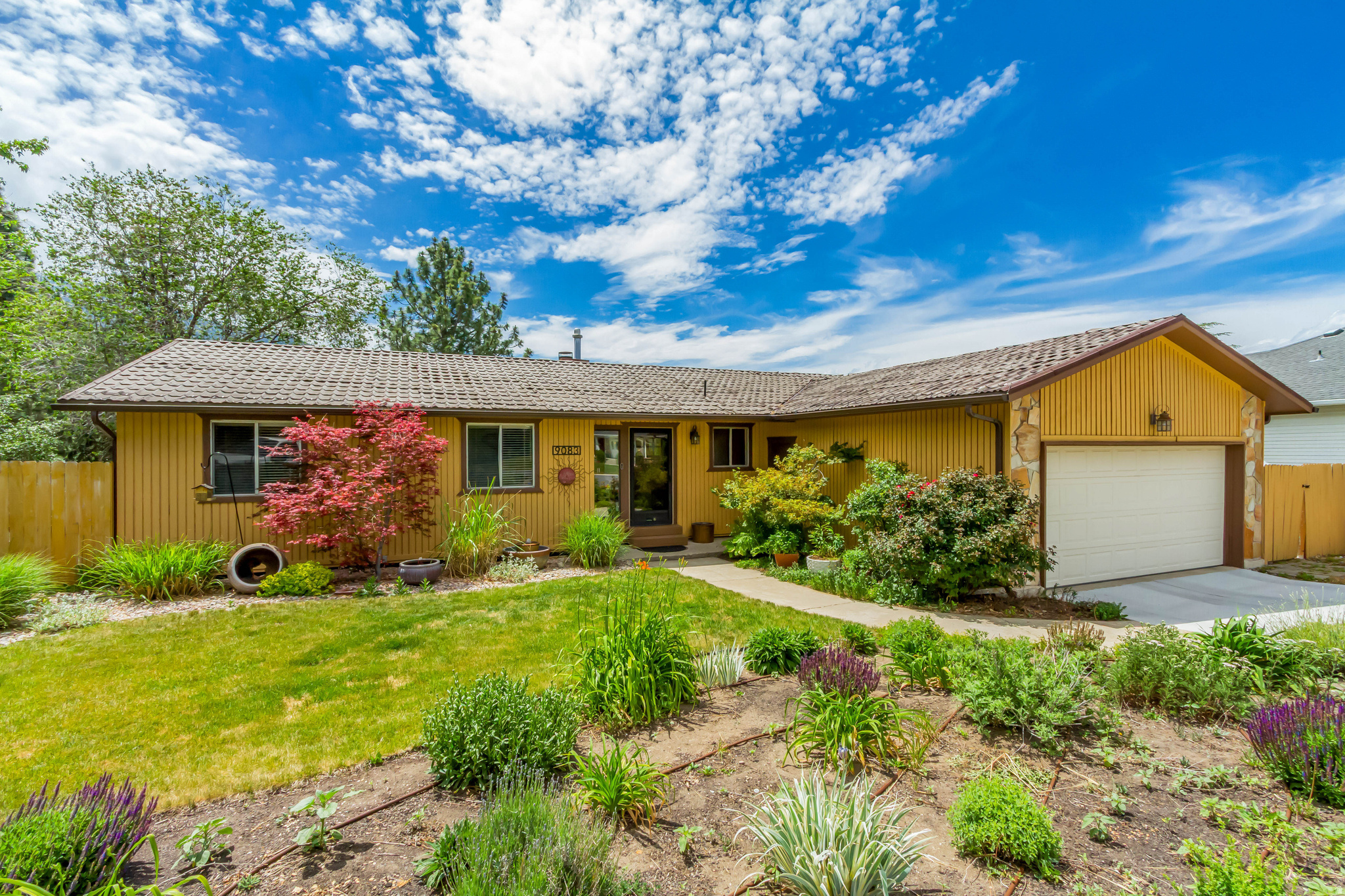 Welcome Home to this beautiful single level residence with walk out basement in a prime Sandy location on a quiet cul-de-sac. This home exudes charm and character. Featuring 4 bedrooms and 3 bathrooms. Enjoy the spacious family room with vaulted ceilings, stone fireplace and AMAZING mountain views. Nice Kitchen with granite countertops, stainless appliances, double oven range, beautiful cabinetry and more. Step outside to your large covered trex deck to also take in the gorgeous view and enjoy your nearby garden boxes or ample grass areas and an included hot tub in your fenced yard with mature landscaping. Don't miss the walk out basement with a very large family room, nearby laundry area, finished bedroom and bathroom as well as plenty of storage space or a 5th bedroom you could finish to make your own. Wired for EV charging in the garage as well. Enjoy the many nearby retail establishments, proximity to the mountains, canyons and more. Don't wait to DOUBLE DOWN on the opportunity to home this amazing home. See you at the Open House Saturday, June 6, 12-2 pm.
