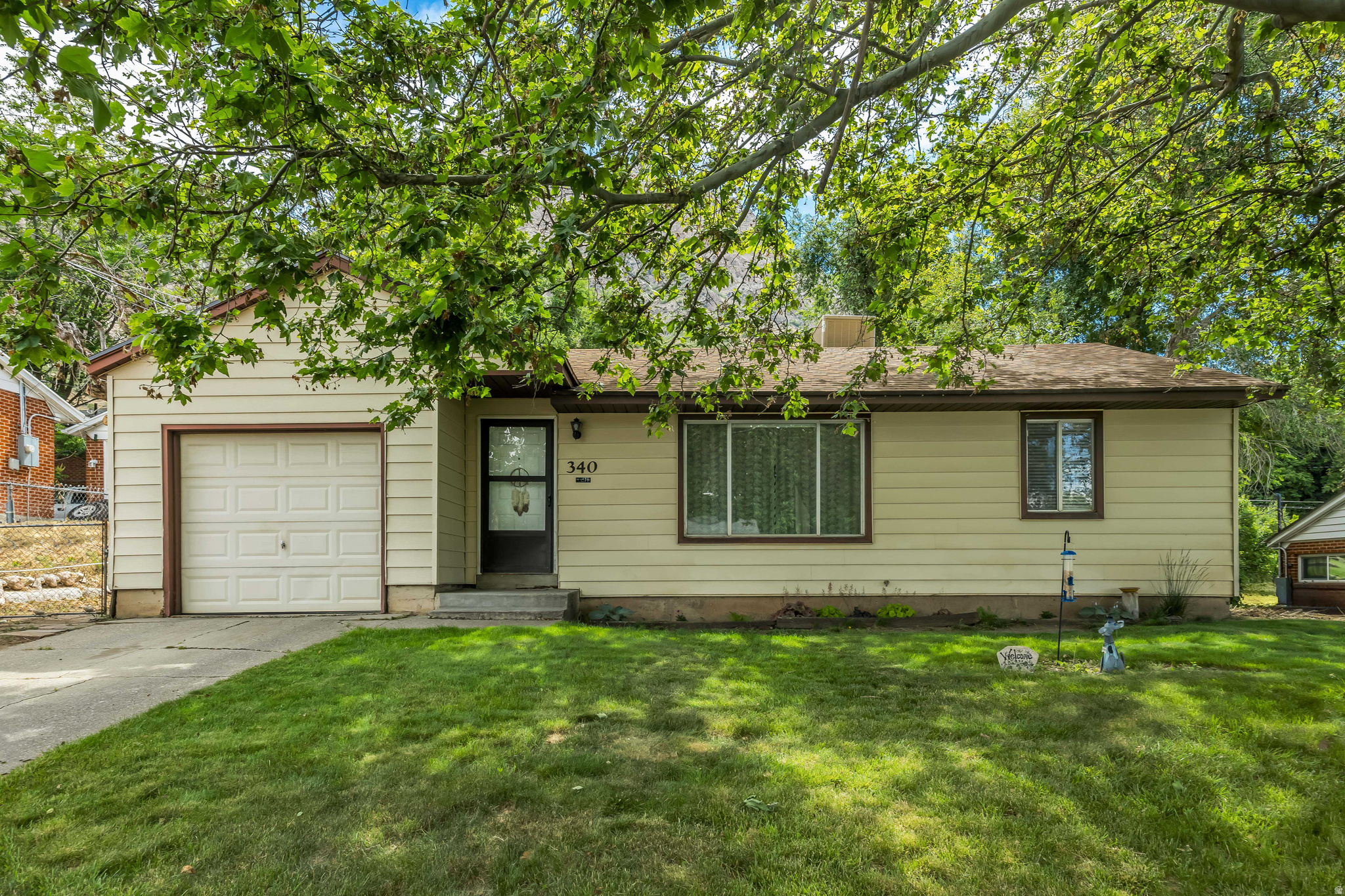 Charming Rambler in the heart of Ogden's El Rancho neighborhood. Clean, bright and move in ready home nestled on a quiet, tree lined, street Minutes from miles of hiking trails and Pineview reservoir. Well maintained home sits on a generous .20 of an acre with full landscaping. This home feature 2 beds and 1 full bath with comfortable single level living. Neutral colors throughout. Large fully fenced yard, with full sprinkler system. Home has secondary water for minimal expense to maintain. New roof installed 7 yrs ago. New evaporative cooler 2 yrs ago.