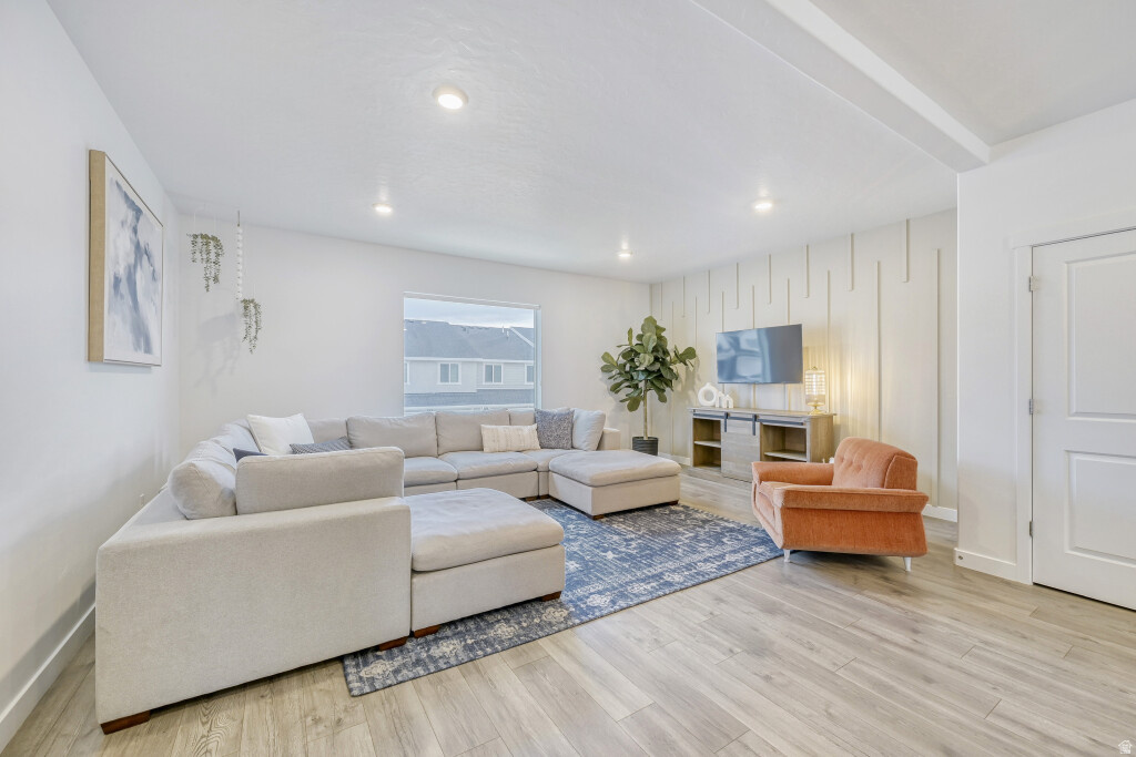 Located in the highly sought-after Northshore community in Saratoga Springs, this well-maintained townhouse offers a functional floor plan, flexible living spaces, and access to exceptional HOA amenities including two swimming pools, a clubhouse, and neighborhood parks. The home features four bedrooms, three full bathrooms, a two-car garage, tall ceilings, and large windows that provide abundant natural light throughout. The open-concept main level seamlessly connects the kitchen, dining, and living areas while also offering a dedicated flex space ideal for a home office, study area, or additional seating. The primary suite includes a private en-suite bathroom, while the lower-level bedroom and full bathroom provide excellent flexibility for guests, multi-generational living, or a private workspace. A rare hidden storage area within the basement crawl space adds valuable storage capacity not commonly found in similar townhomes. With its versatile layout, ample storage, community amenities, and convenient access to shopping, schools, recreation, and commuter routes, this home offers an outstanding opportunity in one of Saratoga Springs' most desirable neighborhoods.