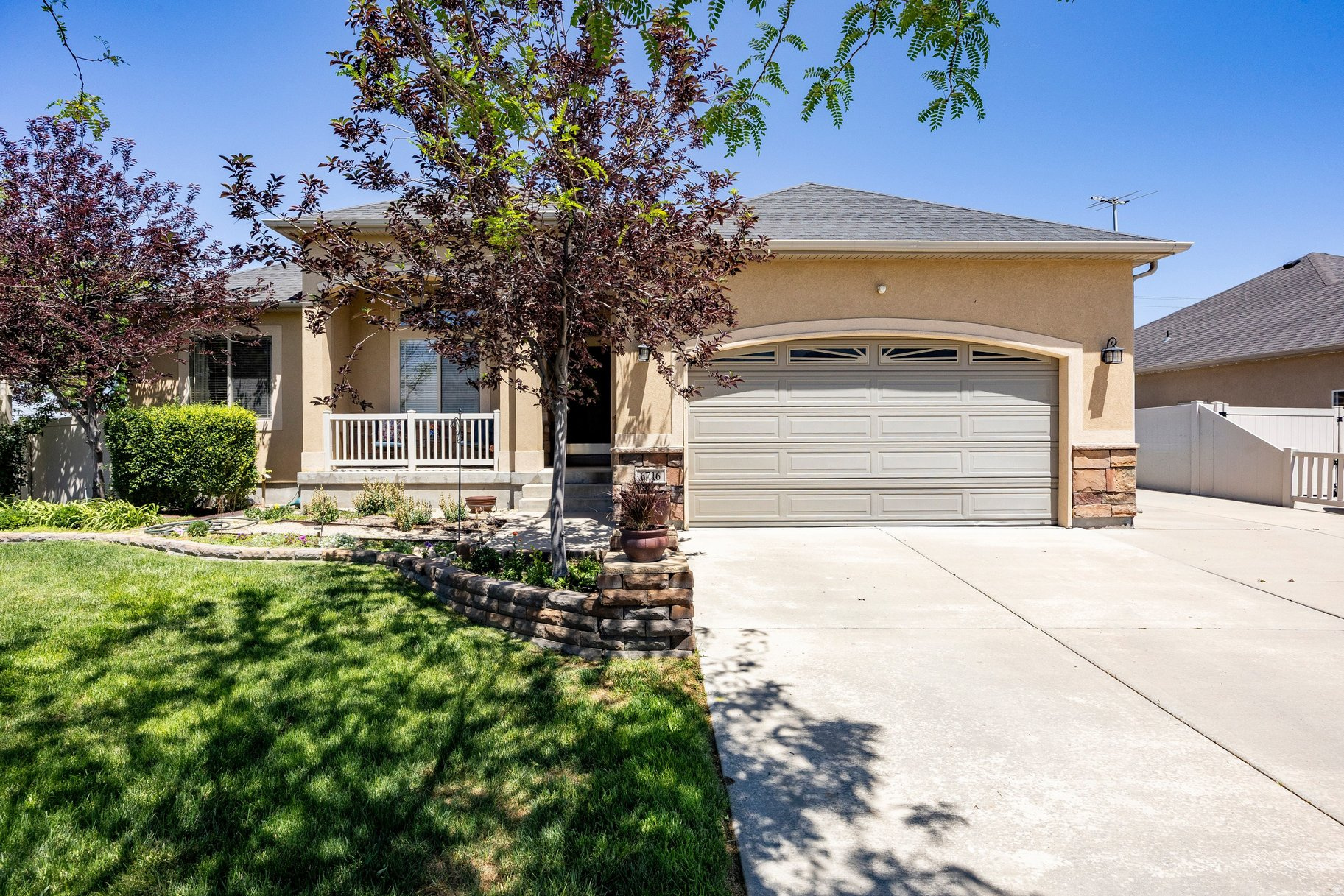 Enjoy single-level living at its finest in this spacious and thoughtfully designed home. The main floor features 3 bedrooms, laundry, and an open-concept layout highlighted by vaulted ceilings in the family room-perfect for everyday living and entertaining. The fully finished basement expands the living space with 3 additional bedrooms, a second family room, a wet bar, and dedicated dining space, creating the ideal setup for gatherings, guests, or multi-generational living. Beautiful hickory flooring and a functional layout make this home a perfect fit for any lifestyle.  Step outside to your own private backyard oasis situated on a large corner lot. The meticulously landscaped yard offers exceptional privacy and features a covered patio, pergola, and a gas line for outdoor BBQs, creating the ultimate setting for relaxing or entertaining year-round.  Conveniently located just minutes from Mountain View Corridor with easy access to I-80, commuting and exploring the valley couldn't be easier. This home truly is an entertainer's paradise.