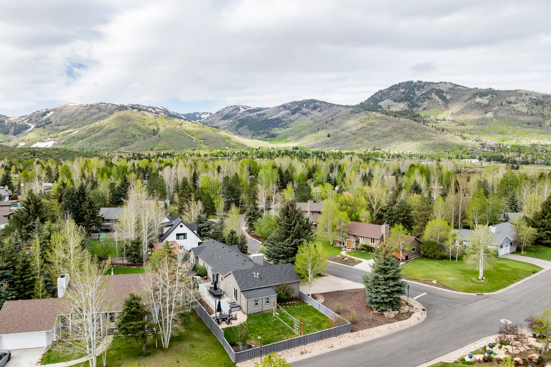 Welcome to 2830 Holiday Ranch Loop Road, a beautifully remodeled home nestled in the heart of Park City, Utah. This stunning residence boasts four spacious bedrooms and three modern bathrooms, offering a generous 2,322 square feet of living space. The extensive remodel completed in 2018 included a brand-new roof, a state-of-the-art radon mitigation system, and updated electrical and plumbing systems, ensuring peace of mind and efficiency. You'll appreciate the luxurious touches, including a tankless water heater, air conditioning, and new Pella windows and doors that enhance both comfort and aesthetics. The garage features an epoxy floor coating, adding durability to your space. The highlight of the remodel is the expansive new primary suite, complete with an indulgent two-head steamer shower, all executed with proper city approvals and permits. This home is a perfect blend of modern convenience and mountain charm, making it an ideal retreat for both relaxation and adventure.