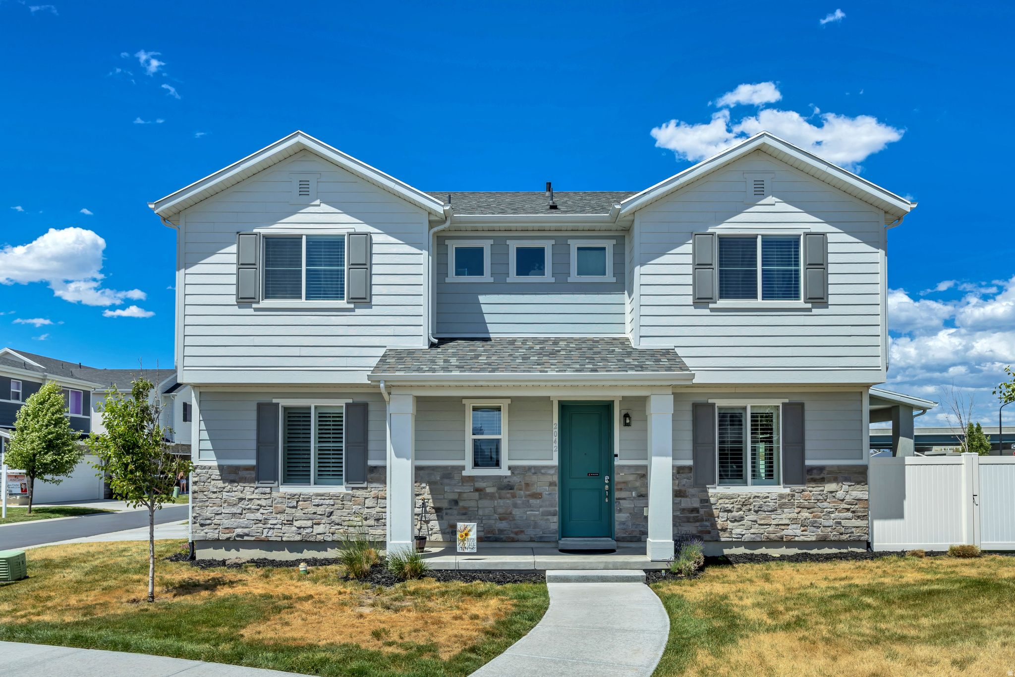Welcome to this beautifully maintained newer construction home in the heart of Syracuse! Built in 2022, this spacious 4-bedroom, 3-bath home offers over 2,000 sq ft of thoughtfully designed living space with an open-concept layout perfect for both everyday living and entertaining. The bright kitchen flows seamlessly into the main living area, while the spacious primary suite features a private bath and generous closet space. Included upgrades consist of permanent exterior custom holiday lighting $4100, custom shutters main level $2800, water softener $2300, and matching Samsung washer & dryer $1350 are ALL INCLUDED.  Enjoy modern finishes, abundant natural light, and a low-maintenance yard in a desirable neighborhood close to parks, schools, shopping, and easy commuter access. This move-in ready home combines comfort, style, and convenience all in one!