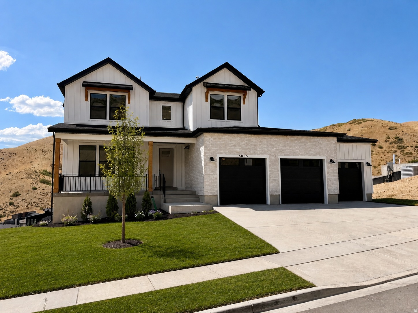 Nearly Completed!! Located in the final phase of Canyon Point, this is one of the last opportunities to own a brand-new home in this highly sought-after community, where demand continues to outpace supply and remaining homes are quickly disappearing. Set on a premium canyon homesite, this stunning farmhouse two-story was intentionally designed to capture breathtaking valley views while offering the perfect balance of luxury, comfort, and everyday functionality. The highly desirable Sage floor plan features a main-level owner's suite and an open-concept layout highlighted by soaring ceilings and a dramatic two-story fireplace with custom shiplap detail that creates an unforgettable first impression. The home is loaded with upgrades that today's buyers are actively searching for but rarely find in one property. Enjoy a covered deck with sweeping valley views, a fully finished walkout basement ideal for entertaining or multi- generational living, and a highly coveted four-car garage. The exterior is elevated with striking black windows, adding a modern farmhouse aesthetic that stands out instantly. Inside, the gourmet kitchen is designed to impress with a premium KitchenAid appliance package, cabinetry extended to the ceiling, and tile carried all the way up for a clean, high-end finish. Quartz countertops are featured throughout, including a large island, while designer gold-finish pendants and faucets add warmth and sophistication. The owner's suite delivers a true retreat experience, complete with an on suite bath that includes a walk in shower and a Maxx Brioso freestanding tub. Situated on a spacious .22-acre lot, this home provides a level of space and privacy that is becoming increasingly rare along the Wasatch Front. With completion scheduled for early August, this home is perfectly timed to hit the market as buyer demand peaks. And with Canyon Point nearing full build-out, opportunities like this are quickly vanishing. Living in Canyon Point means enjoying one of the Wasatch Front's last hidden gems, where hiking and biking trails begin right outside your door, a peaceful mountain setting surrounds you, and yet shopping, dining, and top-rated schools are just minutes away. Residents also enjoy access to a luxury clubhouse, fitness center, resort-style pool, and sport courts, creating a lifestyle that is difficult to replicate. Contact the primary listing agent and visit the model home today to experience the builder's finishes firsthand and learn more about the property-because once this home is complete, expect strong traffic and fast movement. Builder willing to pay for a 4.99%, 30 year fixed interest rate for buyers qualified to close within 30 days! Certain terms and conditions apply, contact listing agent for additional information.