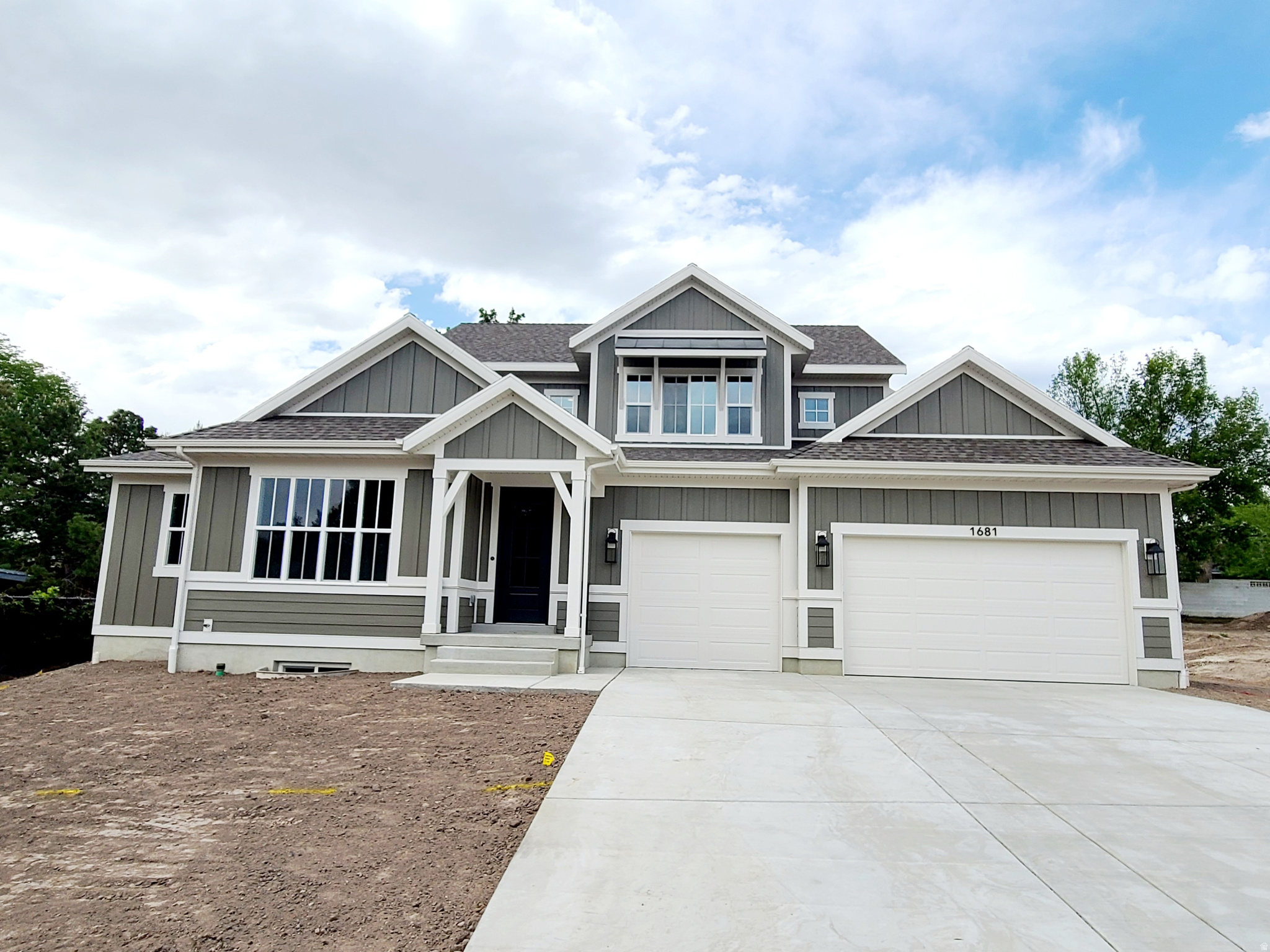 This beautifully moden Edison home offers a perfect blend of modern luxury and timeless charm. The gourmet kitchen features Bluff Maple cabinets with LED lighting, Quartz countertops, Cafe Stainless Steel Gas appliances with double ovens, and a stylish tile backsplash, all highlighted by a box window in the kitchen nook and an atrium door for seamless outdoor access. The spacious Great Room is centered around a cozy gas log fireplace, with can lighting enhancing the ambiance. The luxurious Owner's Suite boasts a box window and a spa-like bath with tile surrounds and bronzed gold hardware. Throughout the home, you'll find durable laminate hardwood flooring, soft carpet in the bedrooms, and pristine tile in wet areas. An expanded garage with an exit door, French doors leading to the office, textured walls, two-tone paint, and Roosevelt base and casing add sophistication and functionality. Additional features include Christmas light outlets, gas lines to the dryer & BBQ, a radon ventilation system, and a gas log fireplace in the Great Room, making this home the ideal blend of comfort and style.