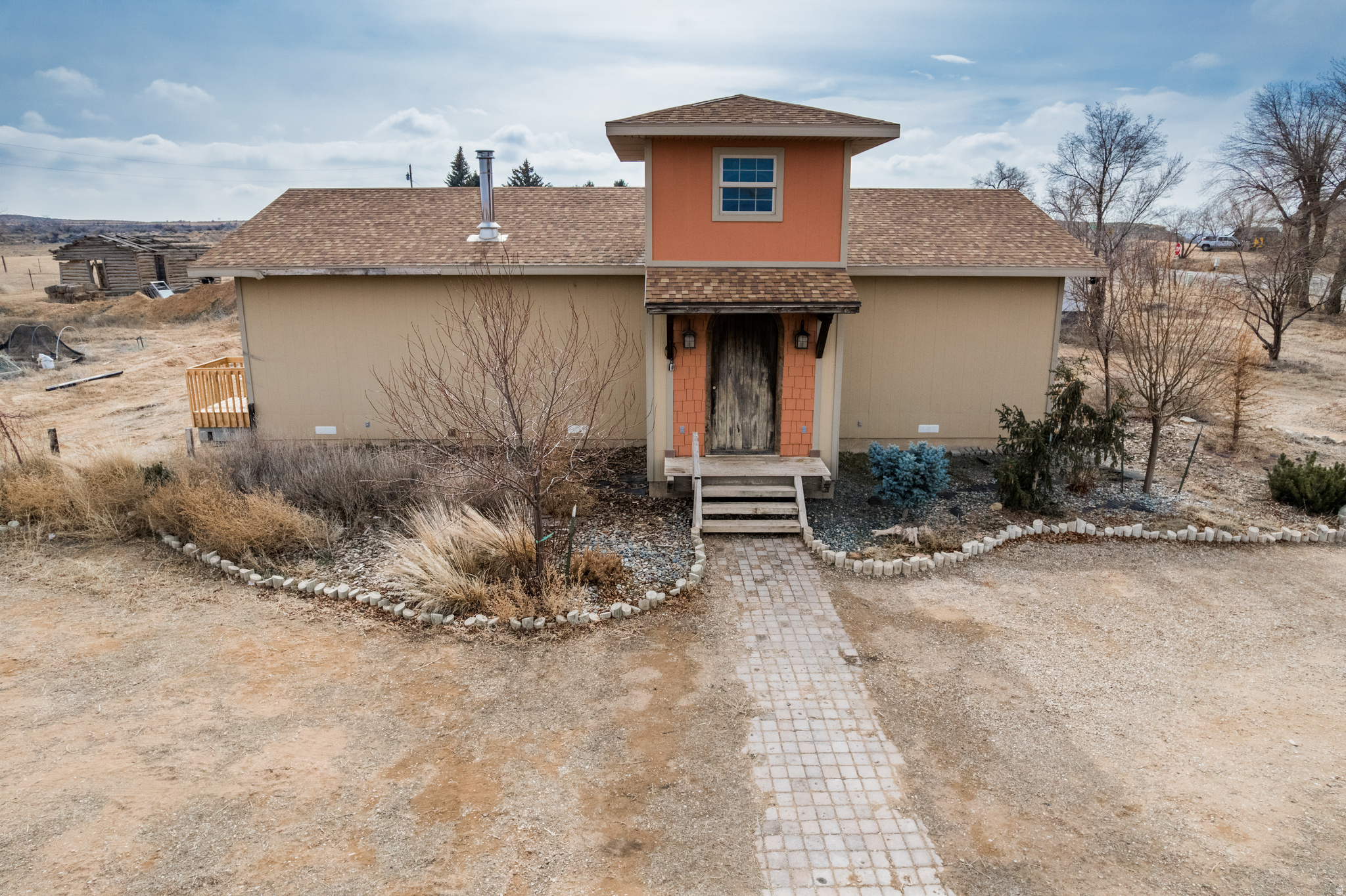 **Buyer Incentive - You chose between: Help towards closing costs, An interest rate buy down OR for the lot to be cleared of the mobile home!** Unique 1,560 sq ft home on 2.02 Acres!! This adorable 2 bedroom, 1 bathroom home has so many custom features including a full pizza oven in the kitchen. Stepping in the front door you will find a welcoming two story entry and ten foot ceilings throughout the home. You must see to appreciate all the upgrades and fun touches. If looking for more land please inquire about the bordering 25.69 Acres that is also for sale. MLS #2136881. If you are interested in both the Acreage and Home, price would be $460,000. www.utahrealestate.com/2136881. Square footage figures are provided as a courtesy estimate only.  Buyer is advised to obtain an independent measurement.