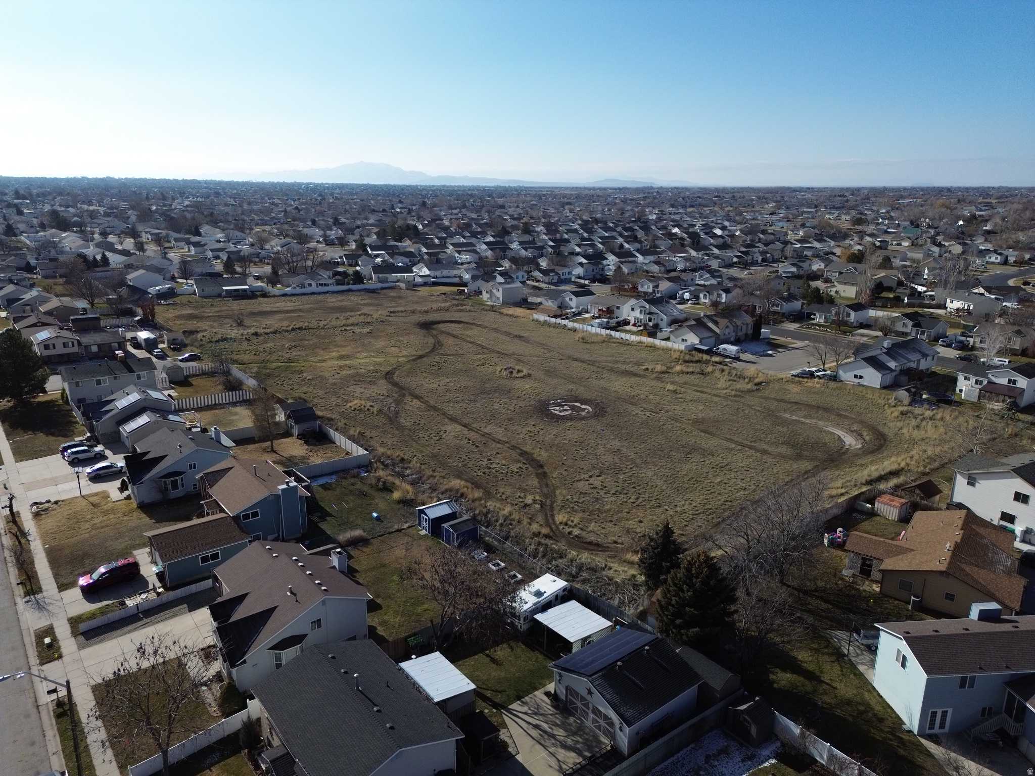 Exceptional development opportunity! This 3.63-acre parcel is ideally located just 15 minutes from the new Syracuse Temple and the Amazon DUT5 Distribution Center, with convenient access to Hill Air Force Base and I-15. Zoned R-1-8 for single-family homes on 8,000 sq. ft. lots, it's also just 5 minutes from the Utah Transit Authority Roy Station and close to Costco and other local amenities. A prime location for developers or investors seeking a highly desirable area. Measurements are estimates; buyers should verify independently. Sold As Is Where Is.