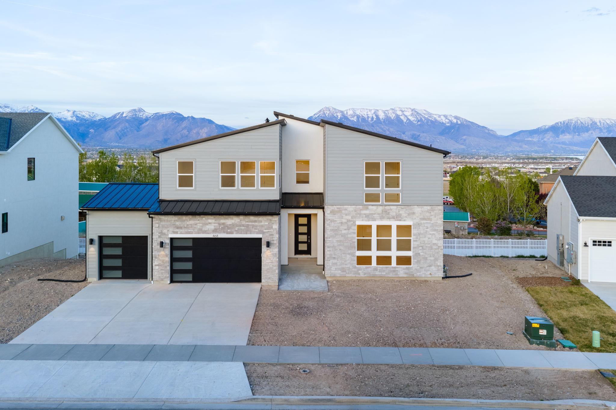 Beautifully designed home featuring a gourmet kitchen, large windows, abundant natural light, and a covered deck perfect for relaxing or entertaining while enjoying mountain and valley views. The thoughtfully designed floor plan includes a main-floor primary suite with a spa-like bathroom featuring a standalone soaking tub, separate vanities, large walk-in shower, and an oversized walk-in closet, plus a main-floor office or additional living room for flexible use. Upstairs offers three spacious bedrooms, two full bathrooms, and a versatile loft area ideal for a second living space, playroom, study zone, or even a home gym.  The fully finished basement adds even more room with three additional bedrooms and two bathrooms, creating excellent space for guests, multi-generational living, or hobbies.  Located in a quaint neighborhood near shopping, dining, and entertainment, this home combines comfort, space, and convenience with beautiful views and ideal function.
