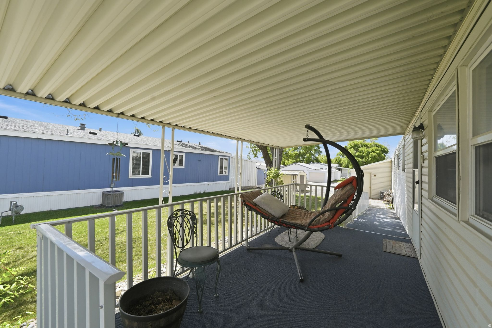 RARE 2-CAR GARAGE + RV STORAGE-an exceptional find in the highly sought-after Winchester 55+ community! This well-maintained 1975 single-wide offers 2 bedrooms, 1 bathroom, and approximately 1,000 sq ft, ideally located directly across from Murray Parkway Golf Course. While the interior reflects its original style, the home is very clean and has been well cared for. Features include central air and a newer membrane roof for added comfort and peace of mind. Set back from the busy road, this property offers added privacy and a peaceful setting, perfect for enjoying the covered porch and spacious yard. A large storage shed provides additional space for tools, hobbies, or outdoor gear. Lot rent is $1,075/month and includes sewer, water, and trash. Buyer to verify park approval requirements.