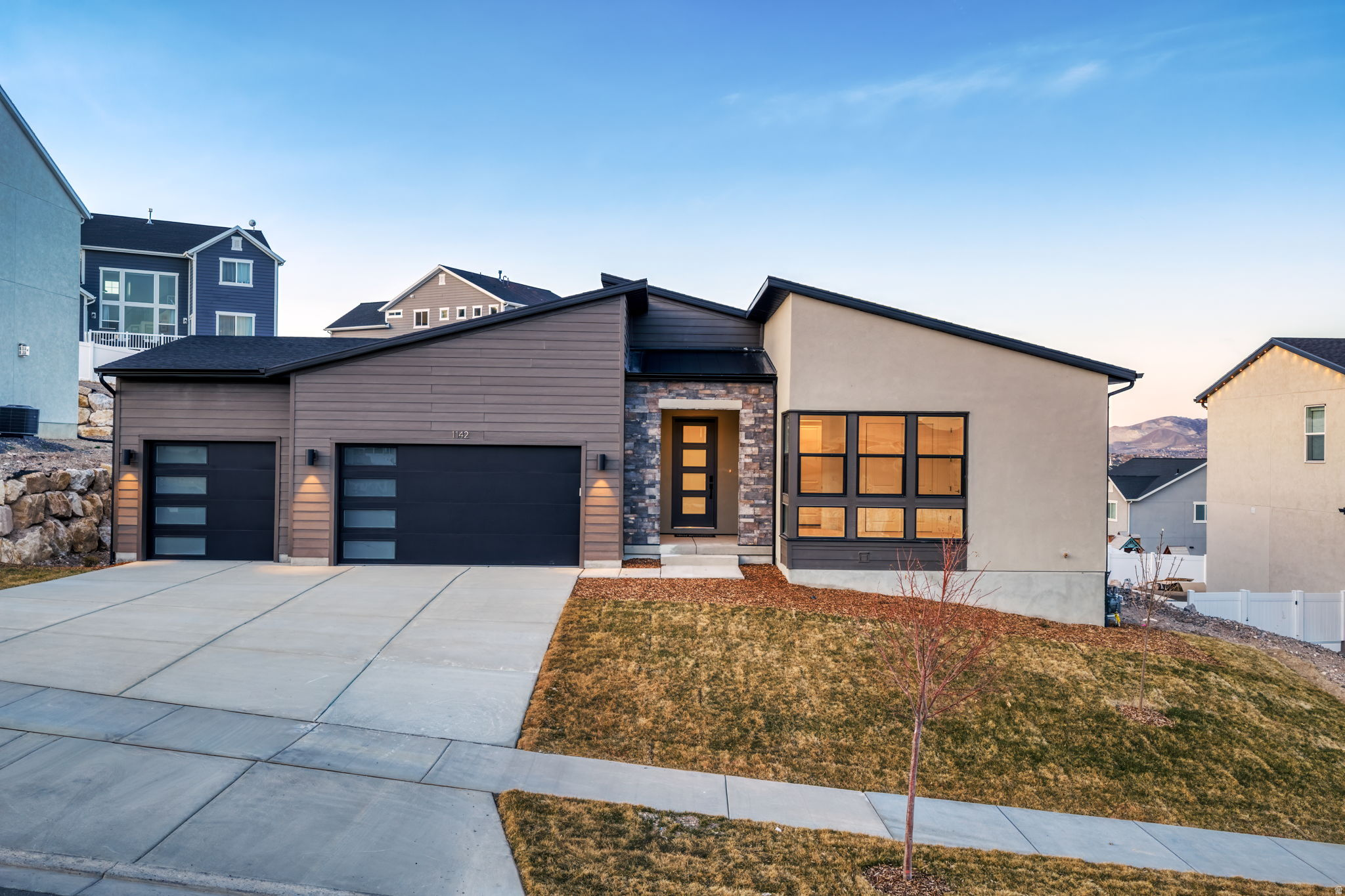 Experience elevated single-level living in the Chelser Mountain Modern, located in the scenic hillside community of Westlake Vistas in Saratoga Springs, Utah. This thoughtfully designed luxury home combines convenience with contemporary architecture, featuring clean lines, expansive windows, and a bright open layout filled with natural light. The spacious great room centers around a cozy fireplace and flows seamlessly into the gourmet kitchen with oversized island and walk-in pantry - perfect for entertaining and everyday comfort. The layout provides ideal separation between living and guest spaces while maintaining effortless accessibility throughout the main floor. The finished basement expands the homes versatility with additional bedrooms, bathrooms, and expansive gathering space-perfect for multi-generational living, guests, or secondary entertainment area. Enjoy proximity to trails, parks, shopping, commuter routes, and outdoor recreation while living in a highly sought-after new construction luxury neighborhood in Utah County.
