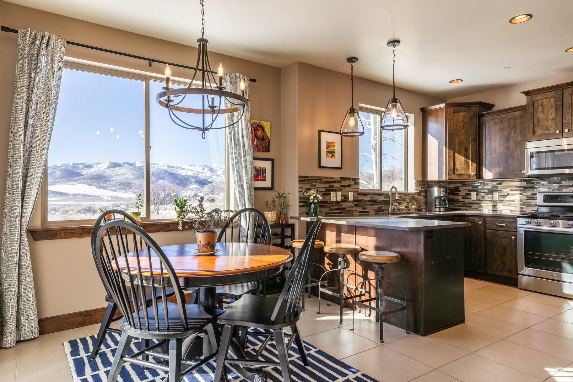 Experience effortless mountain living at Black Rock Ridge, a beautifully maintained condominium with rare ski slope views of both Deer Valley and Park City. This spacious 3-bedroom, 2-bath condo flat residence has never been rented and offers thoughtful design, abundant storage, private garage, and inviting natural light throughout. The residence does not require an elevator or stairs to access. Perfect for full-time living or hosting family and friends, the open-concept layout and private garage provide both comfort and convenience. Eligible for nightly rentals (7-night minimum), this home blends lifestyle and flexibility. Enjoy easy access to everything-just 15 minutes to Park City's Main Street, 10 minutes to Kimball Junction, and 10 minutes to Deer Valley's new East Village. A rare opportunity to own a turnkey mountain retreat where unmatched sunset views, location, and quality come together beautifully.